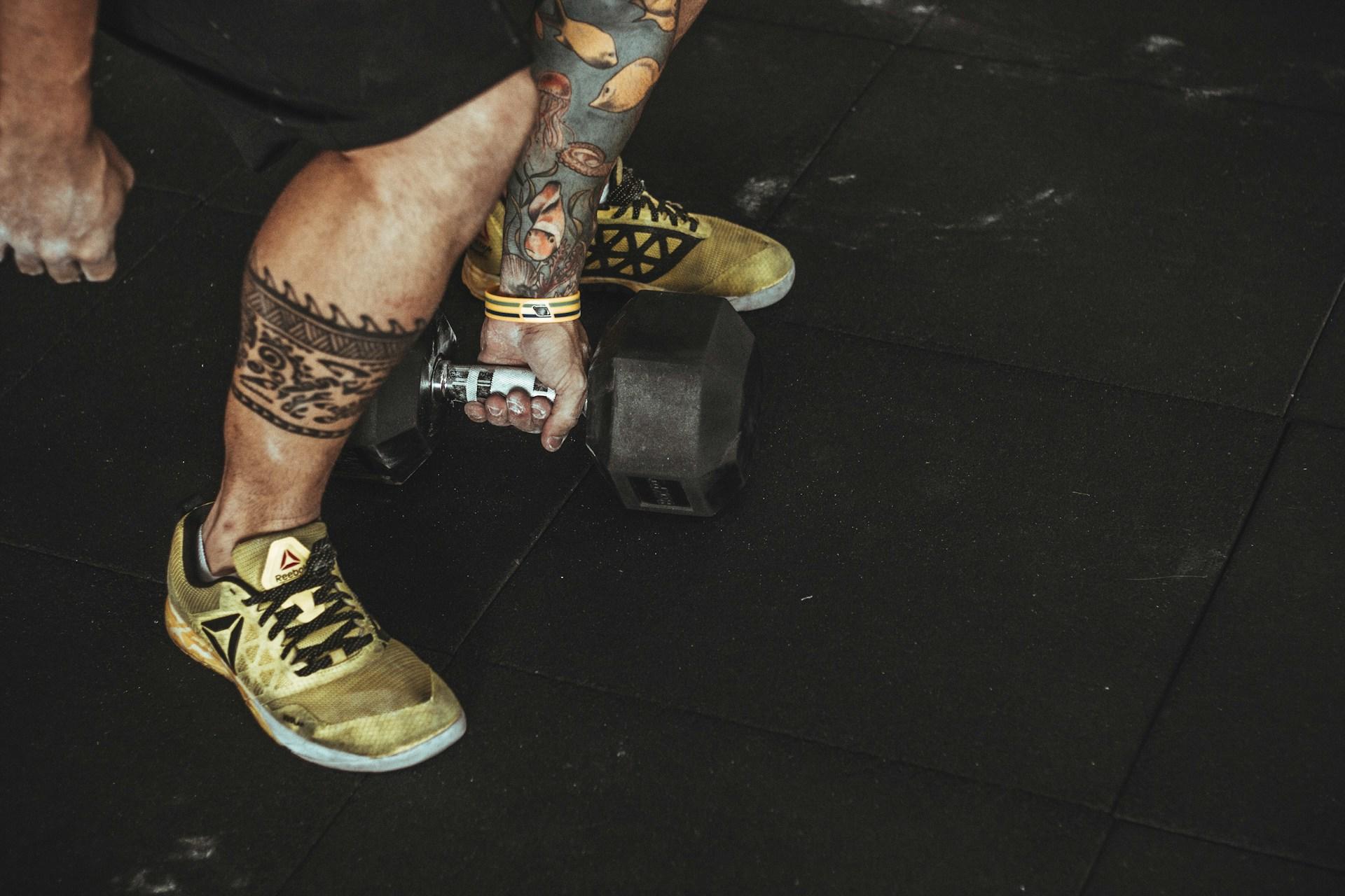 A man lifting a dumbell.