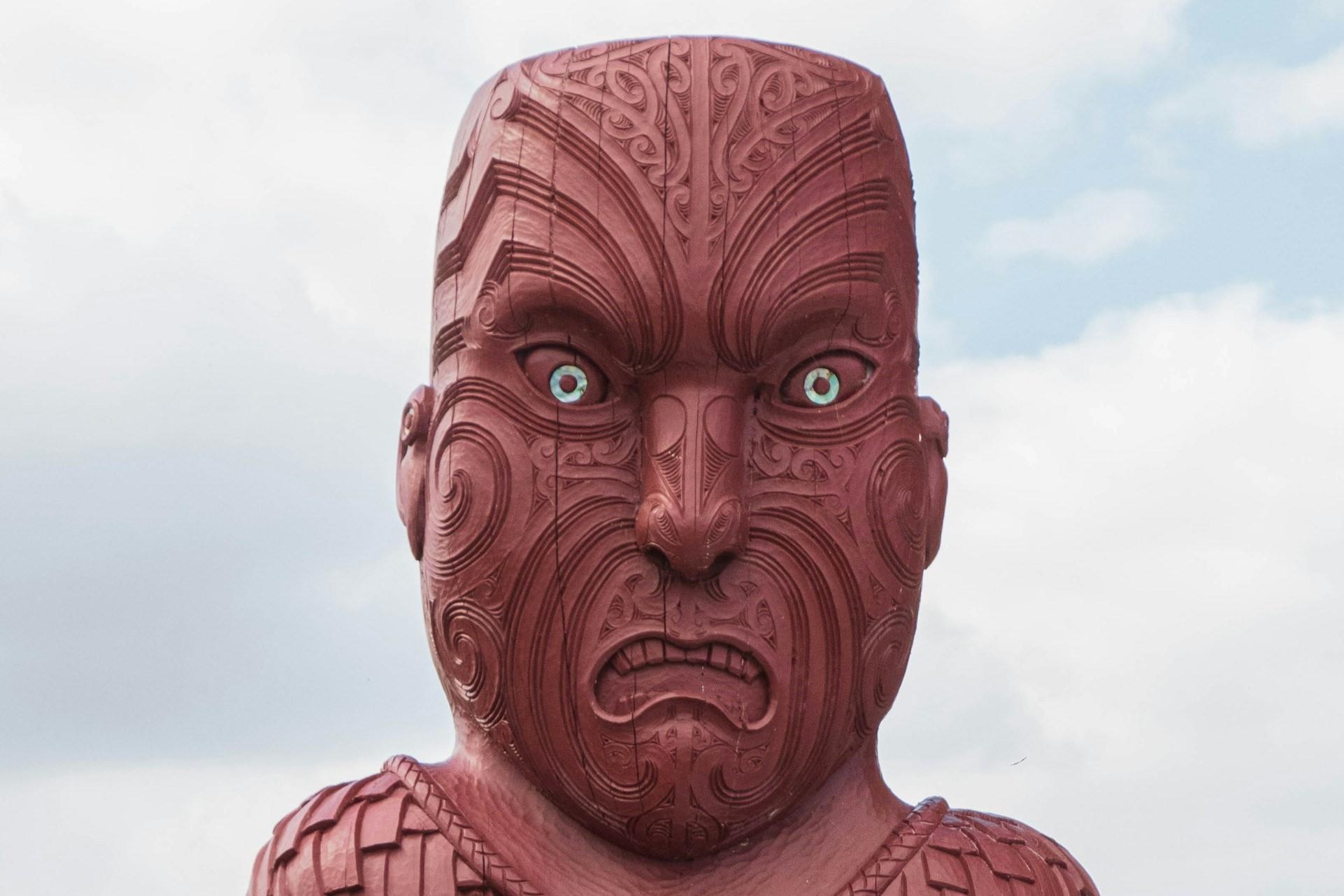 A Maori statue with a moko.