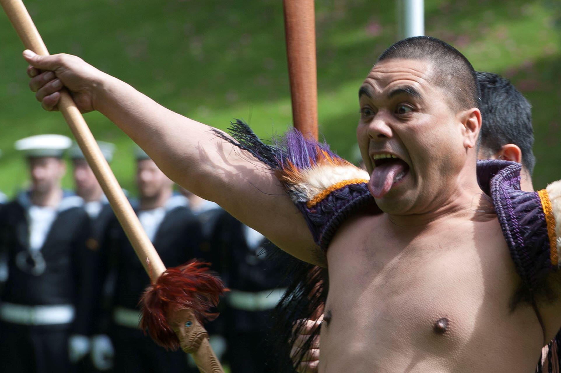 A man in the middle of the Haka.