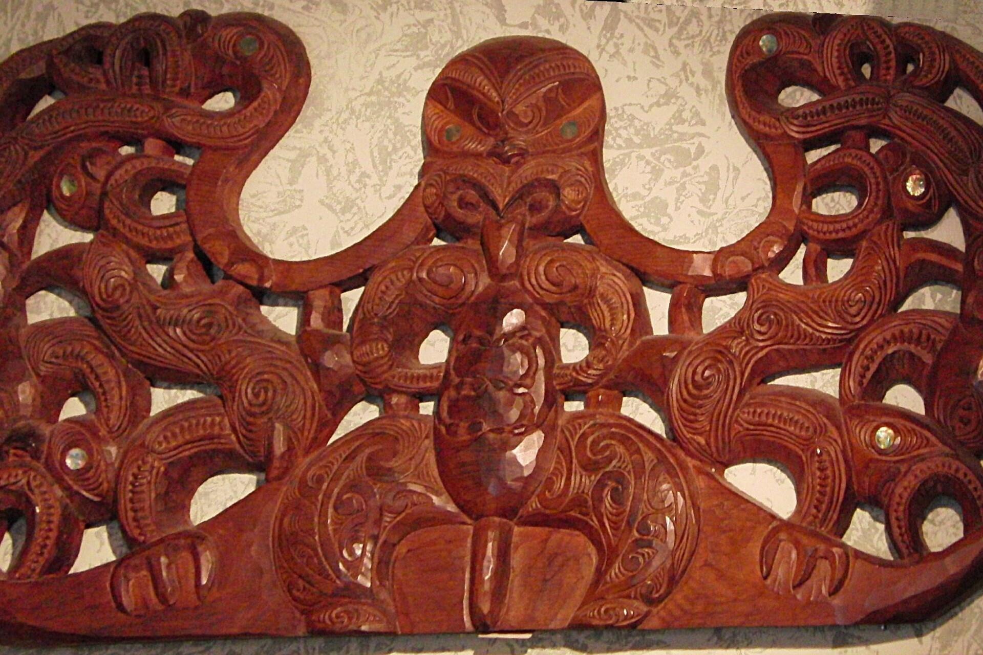 A wooden Maori door lintel.