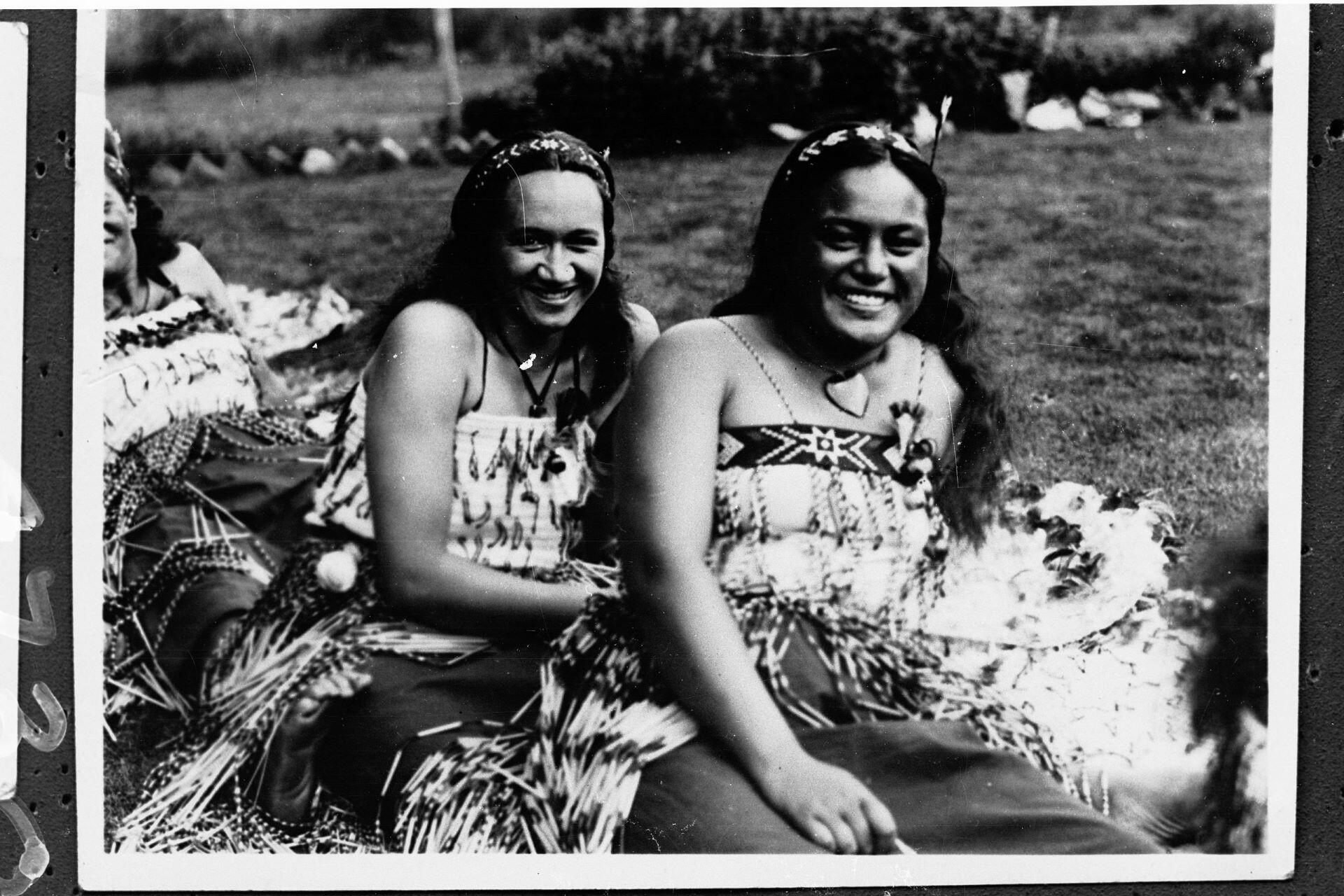 Two maori women smiling.