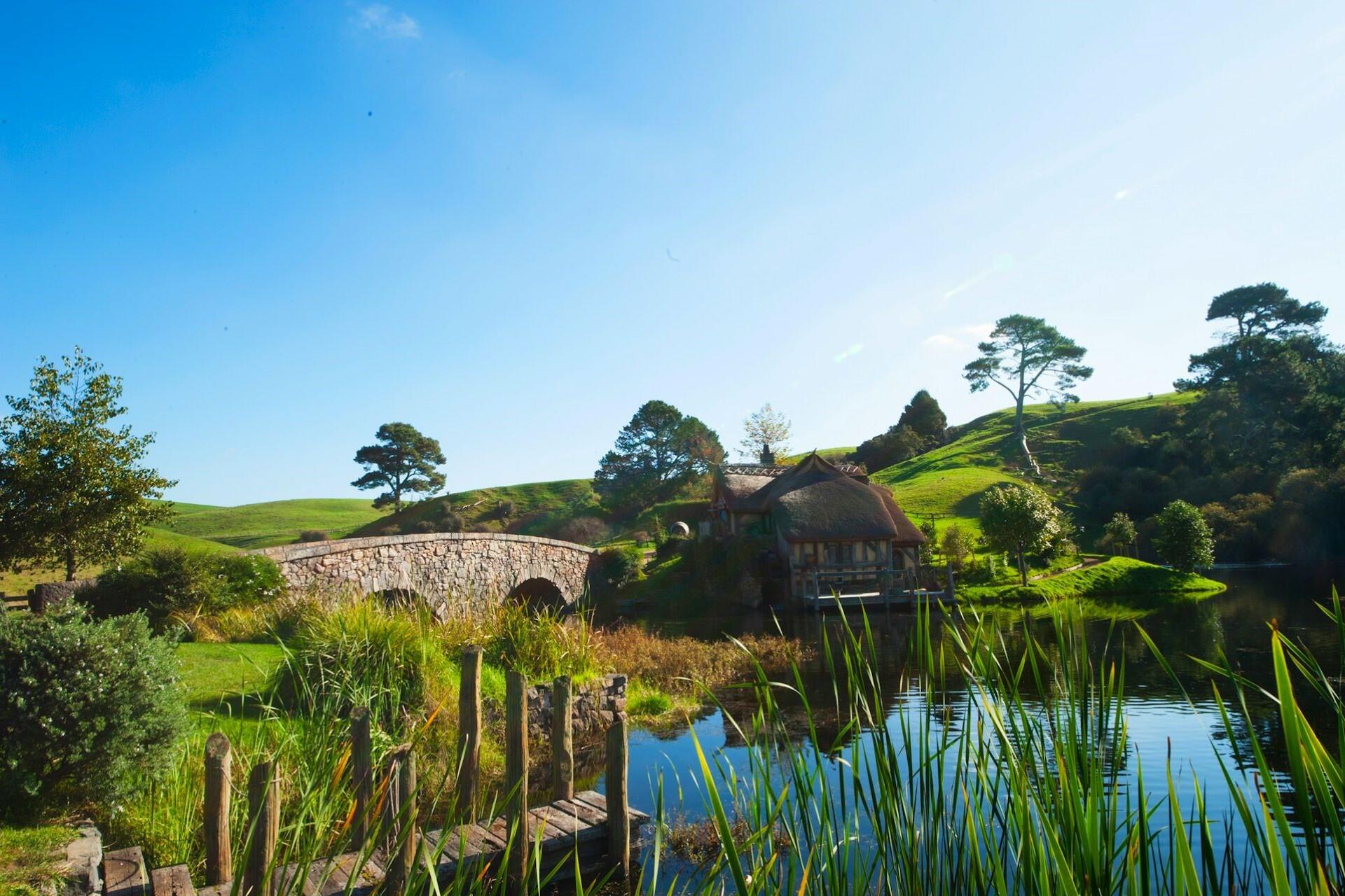 A lake and a house in Hobbiton, New Zealand.