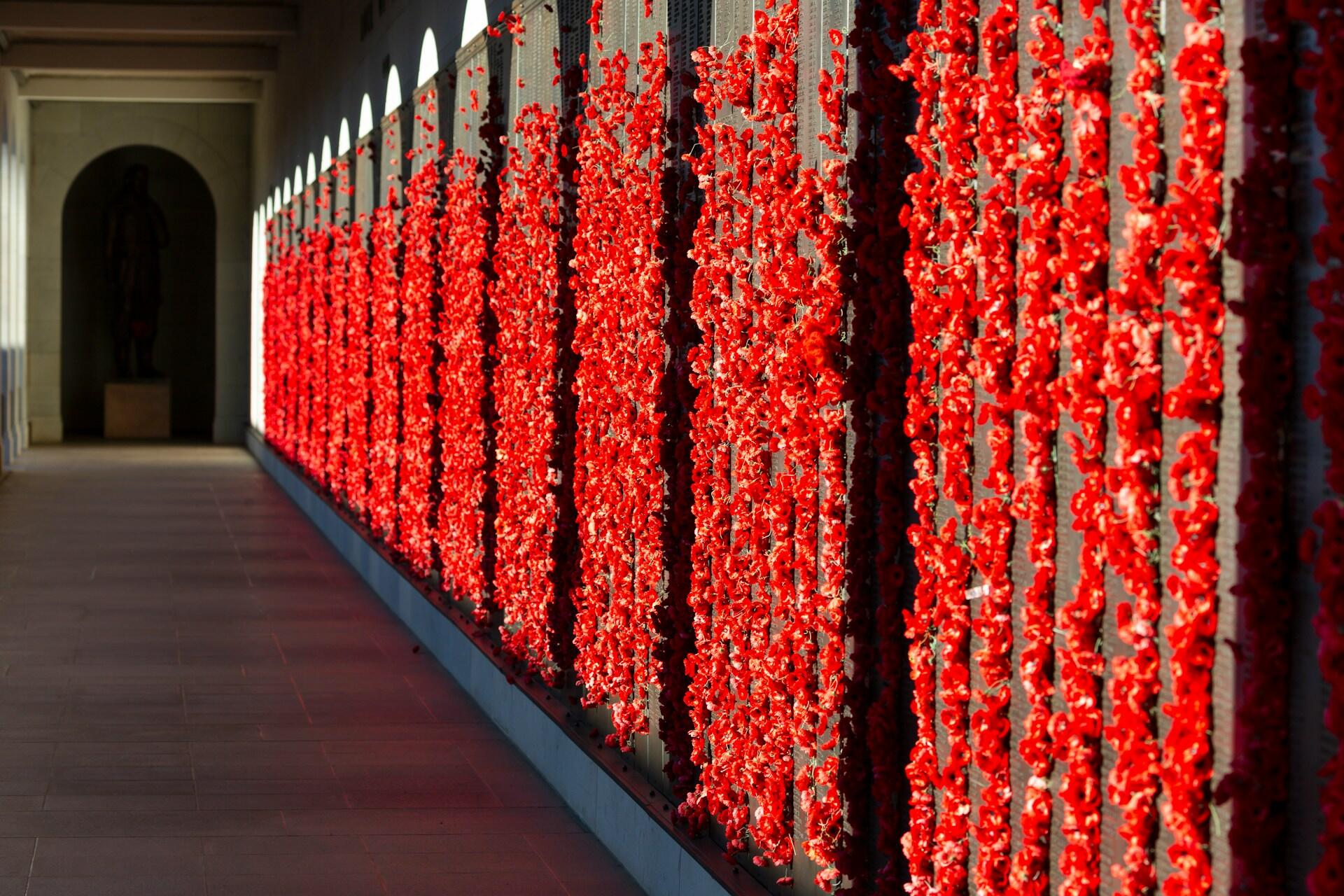 An Anzac memorial with poppies.