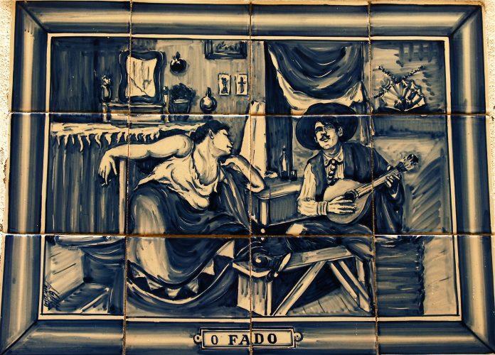 An artwork of a woman watching a man play guitar.
