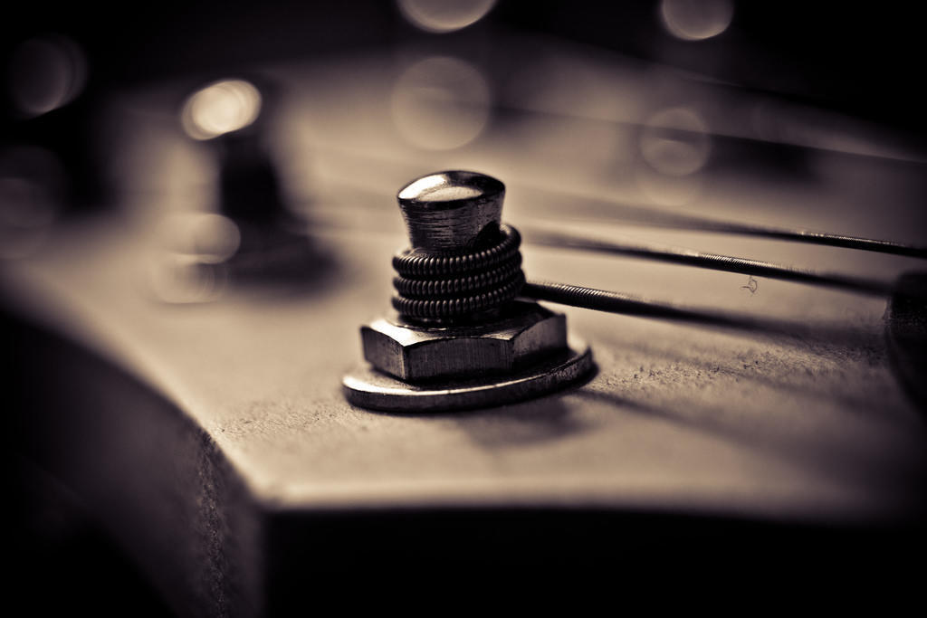 tuning tun on the headstock of a guitar, with strings