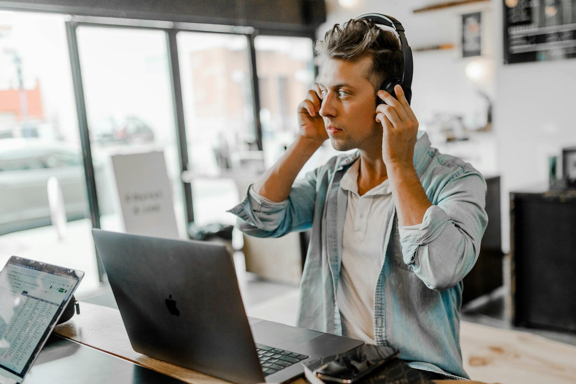 A person listening to something in an office.