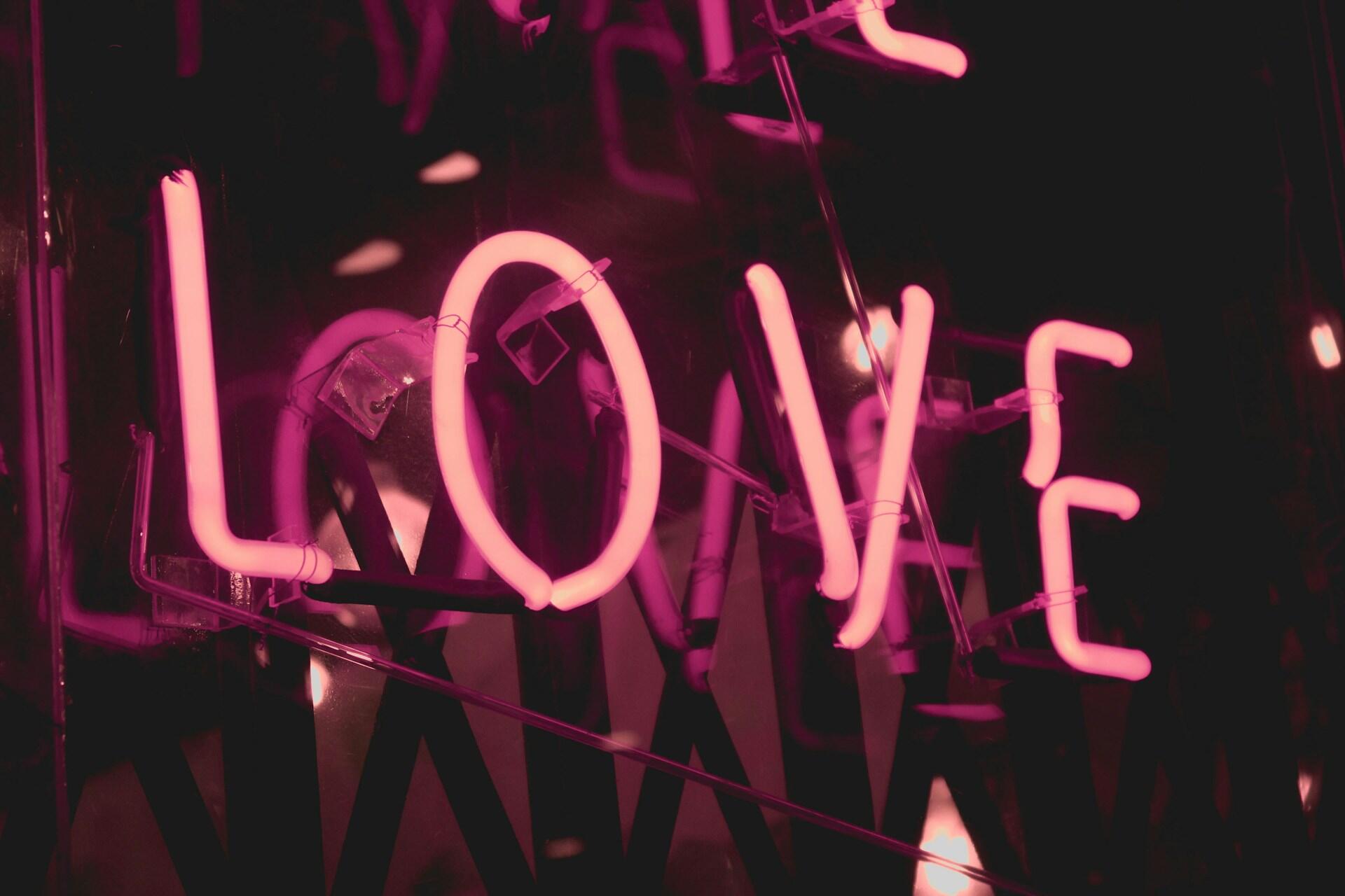 The word "Love" in a neon light.
