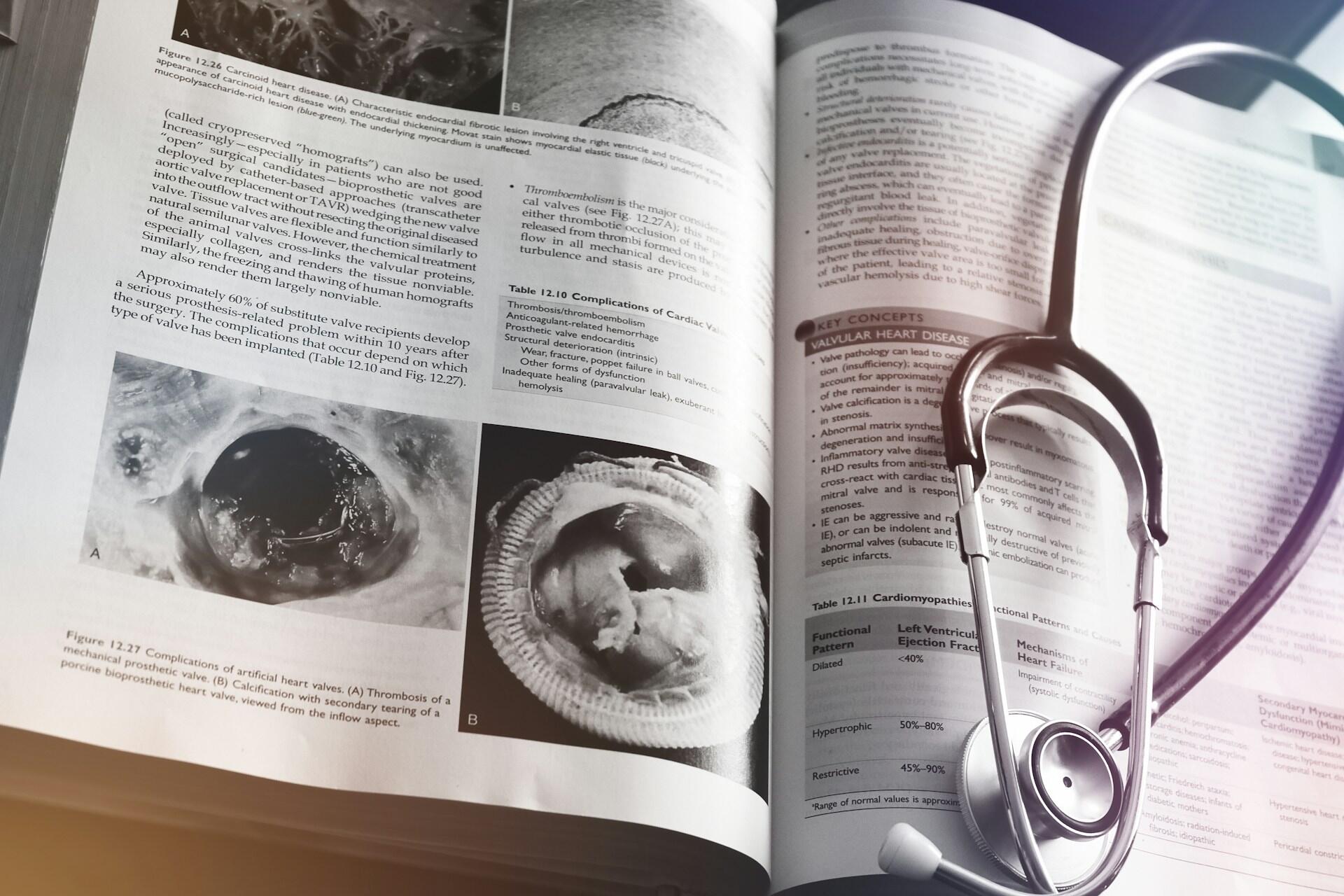 A medical textbook and a stethoscope.