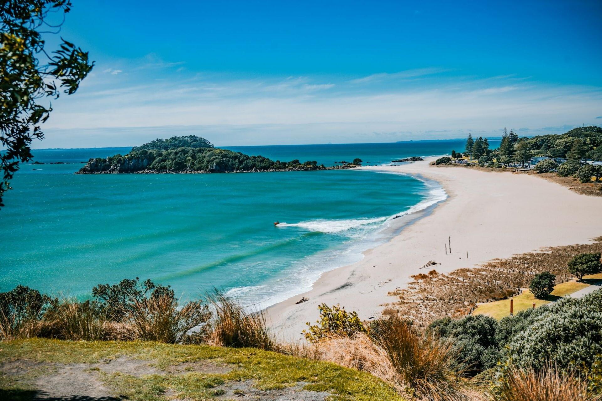 Coastal landscape at Mount Maunganui with ocean, beach, and sky meeting the land.