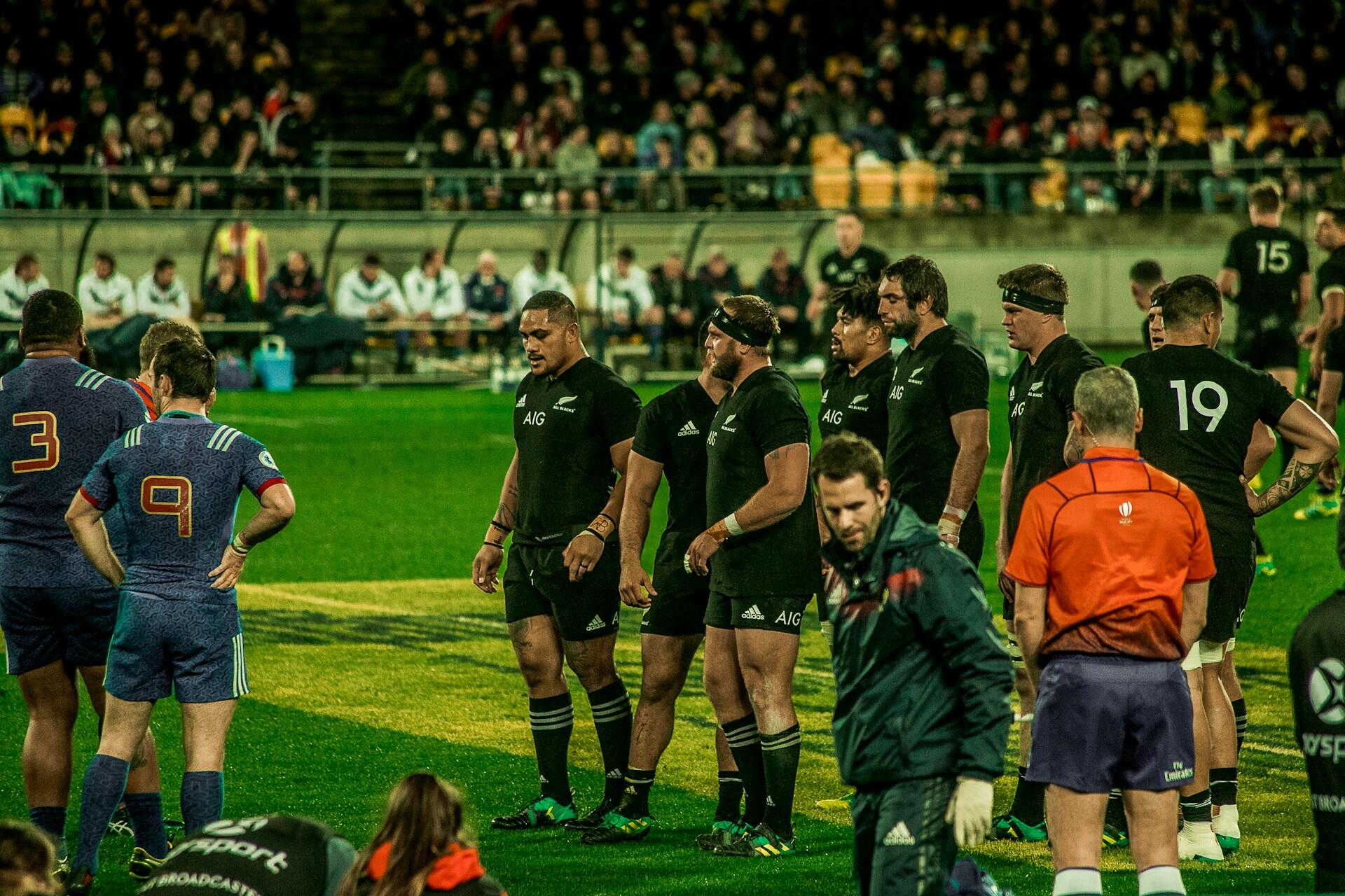 All Blacks rugby players on the pitch during a match