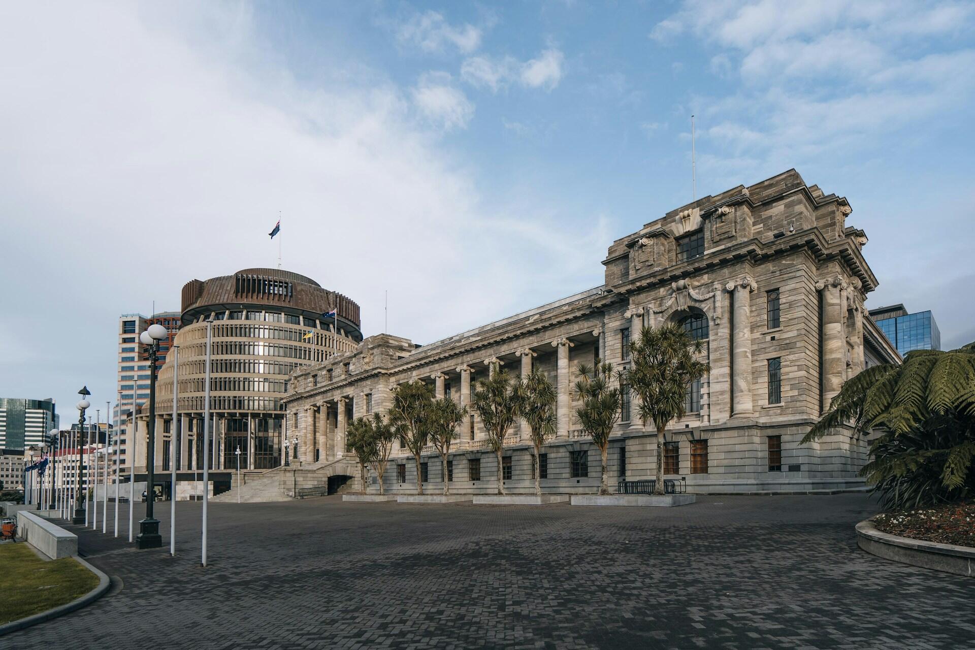New Zealand Parliament buildings and the Beehive beneath a blue sky