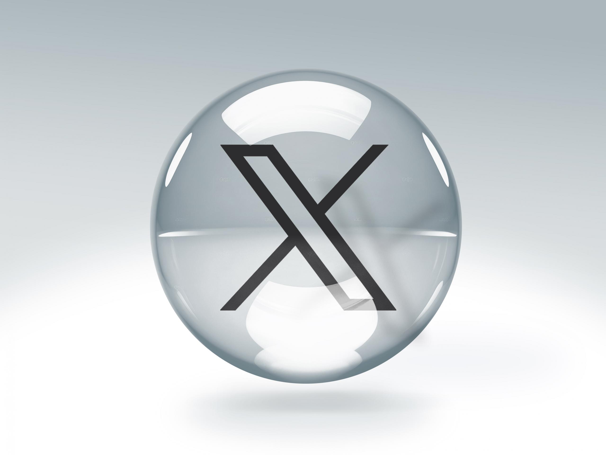 logo X en una burbuja gris