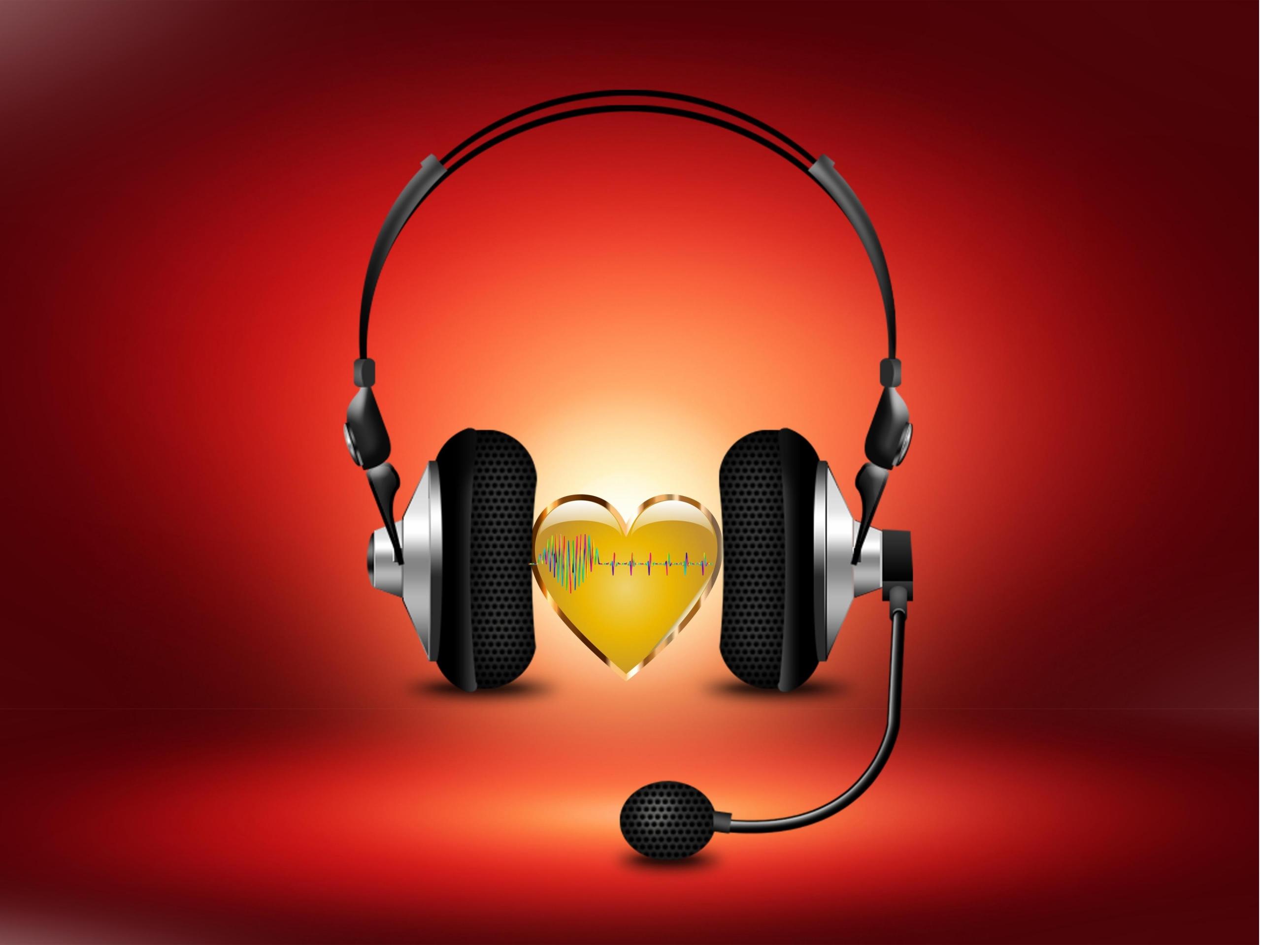 Słuchawki z mikrofonem i serce, na czerwonym tle.