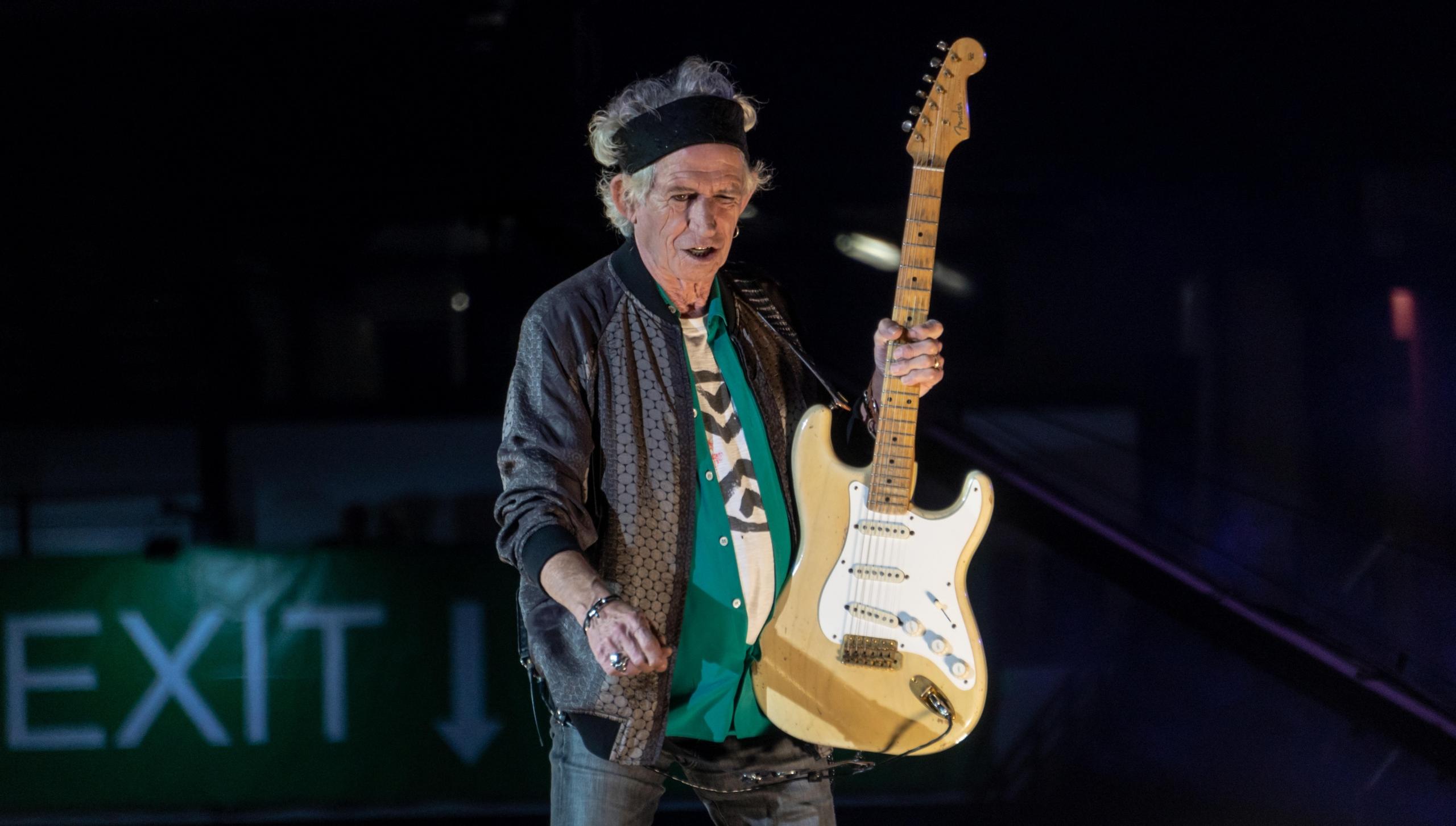 Keith Richards twórca romantycznych utworów na gitarę, koncert, występ muzyczny.