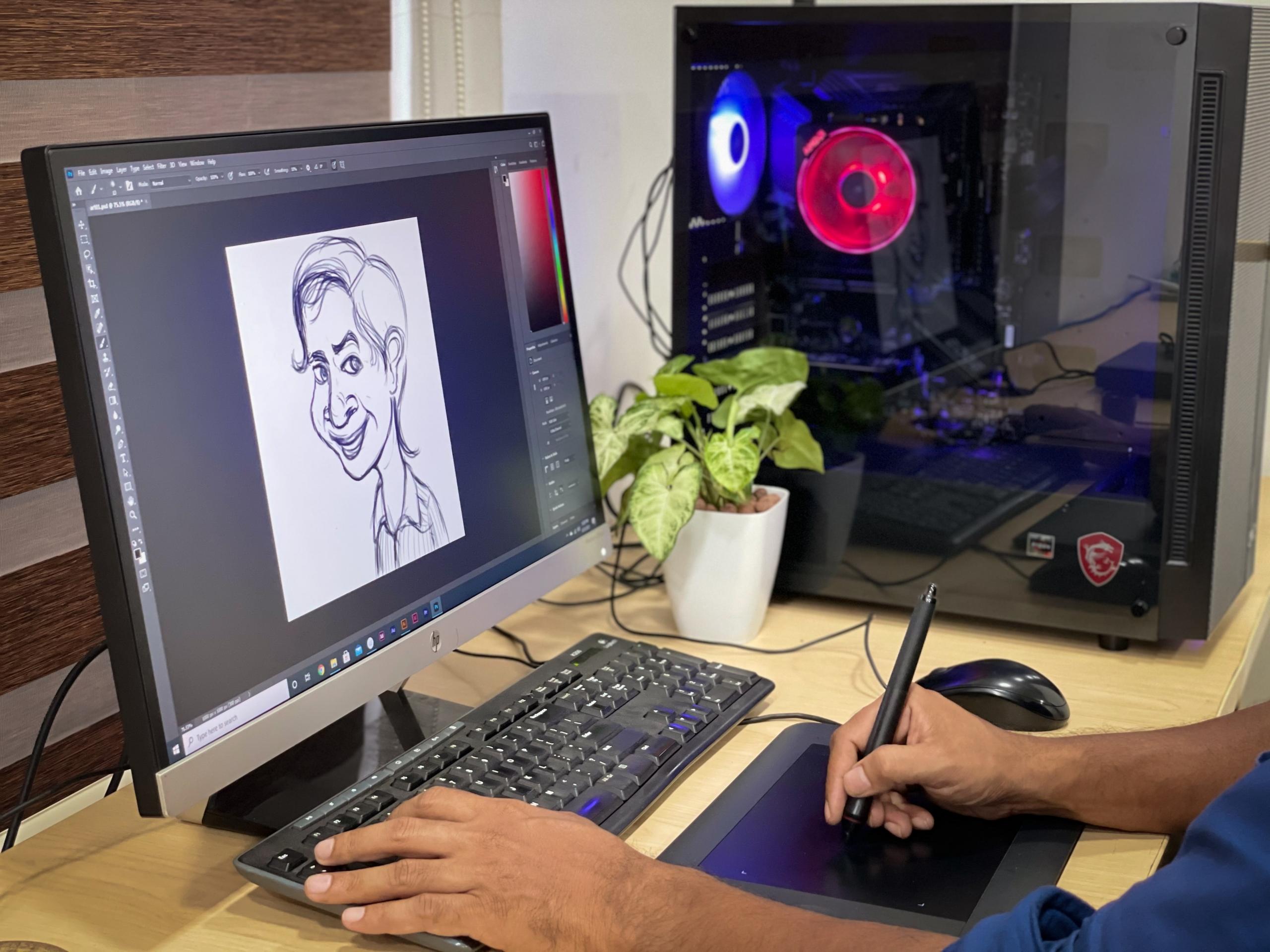 osoba rysująca na tablecie graficznym karykaturę w programie adobe photoshop