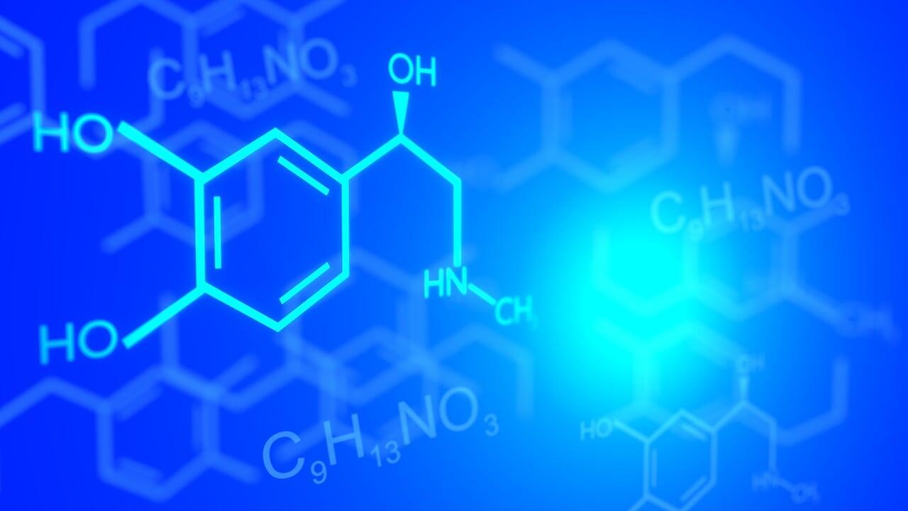 Wizualizacja cząsteczek chemicznych na niebieskim tle