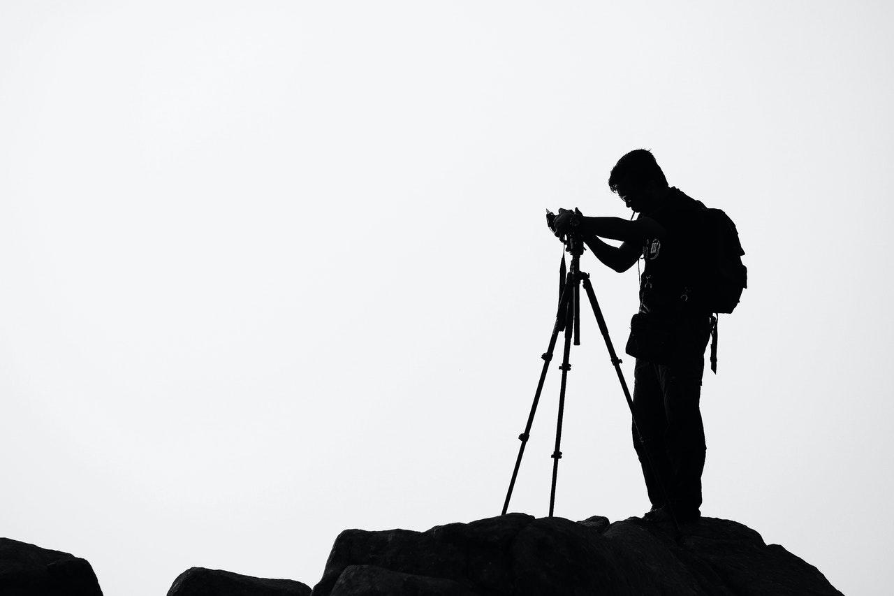fotografo com camara