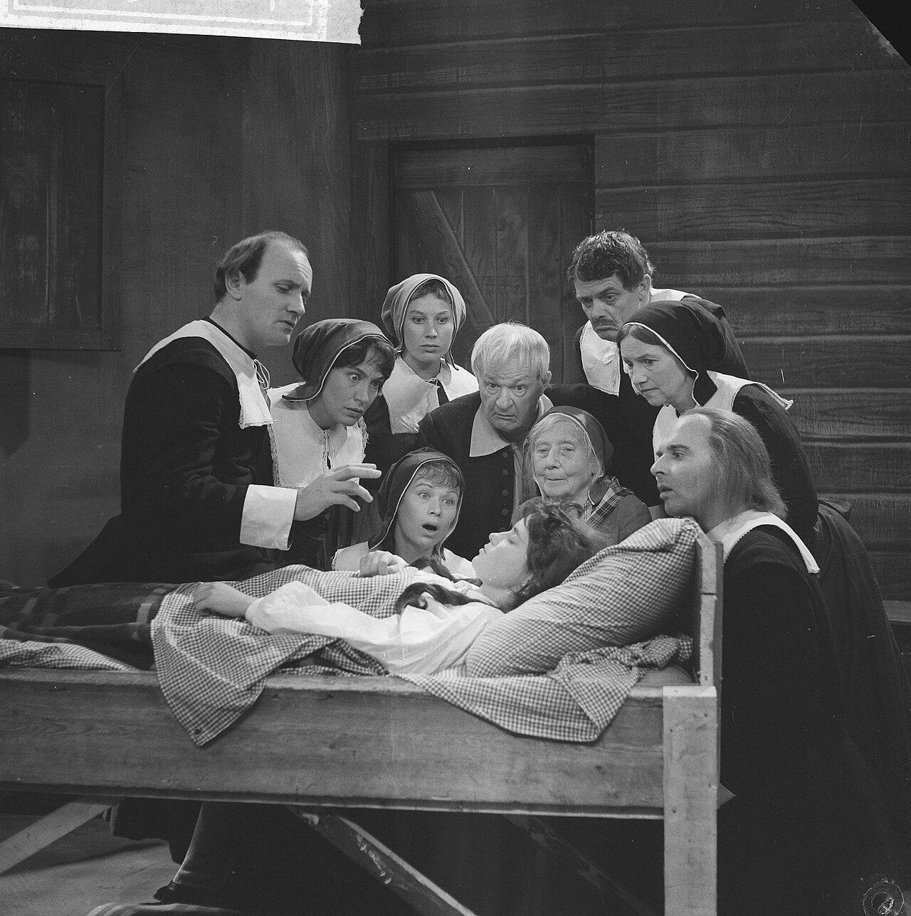 A scene from the crucible, characters gathered around 