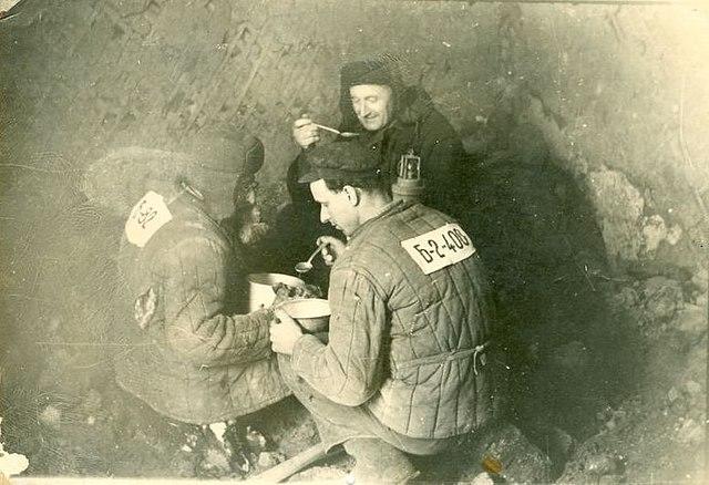 Prisoners eating in Gulag Camp