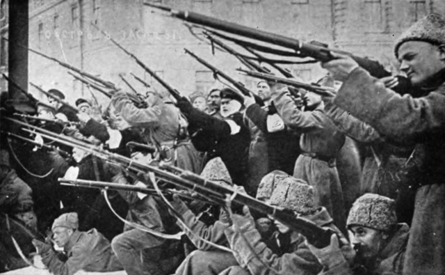 Soldiers aiming off camera during the Russian Revolution