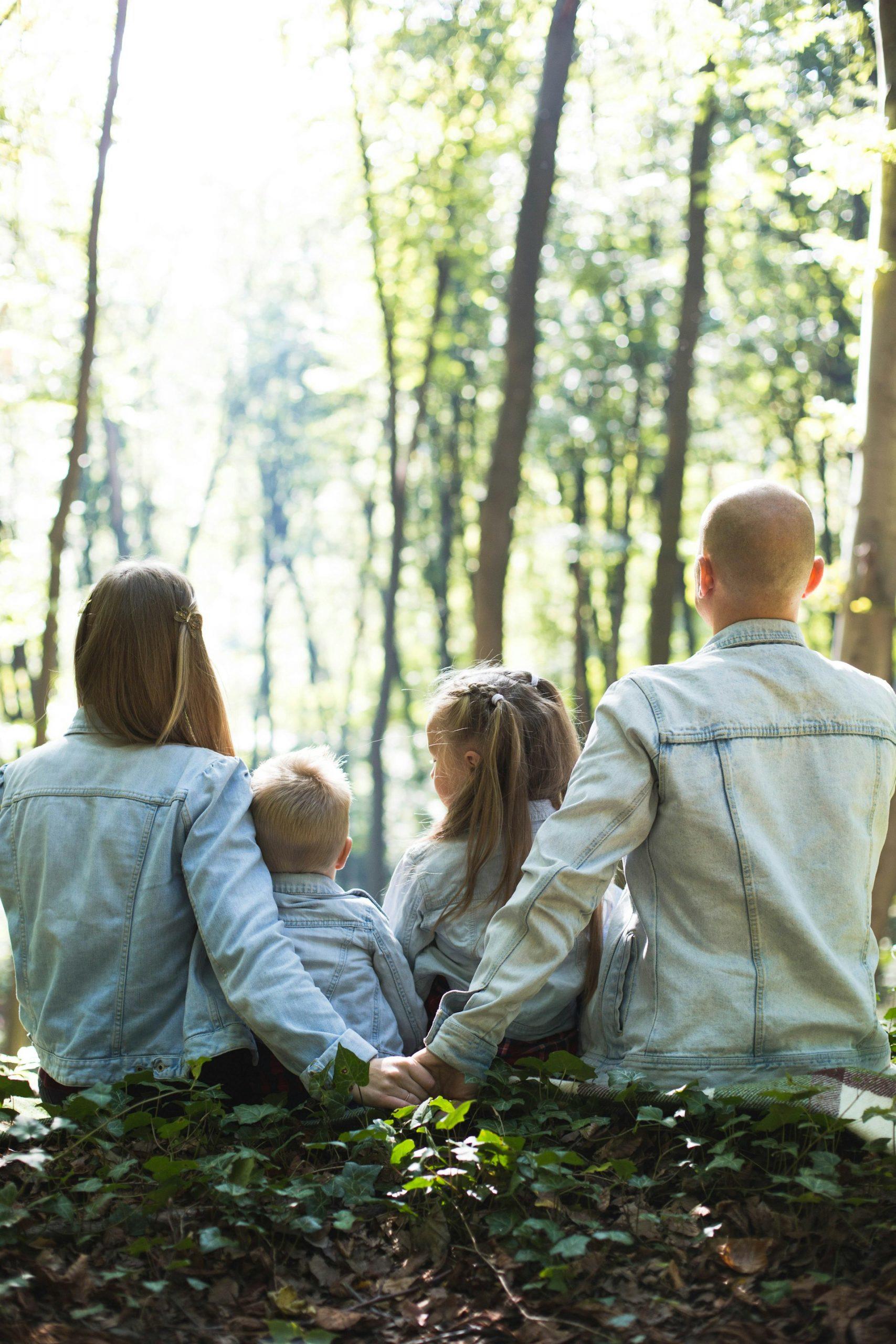 a family resting under the tree