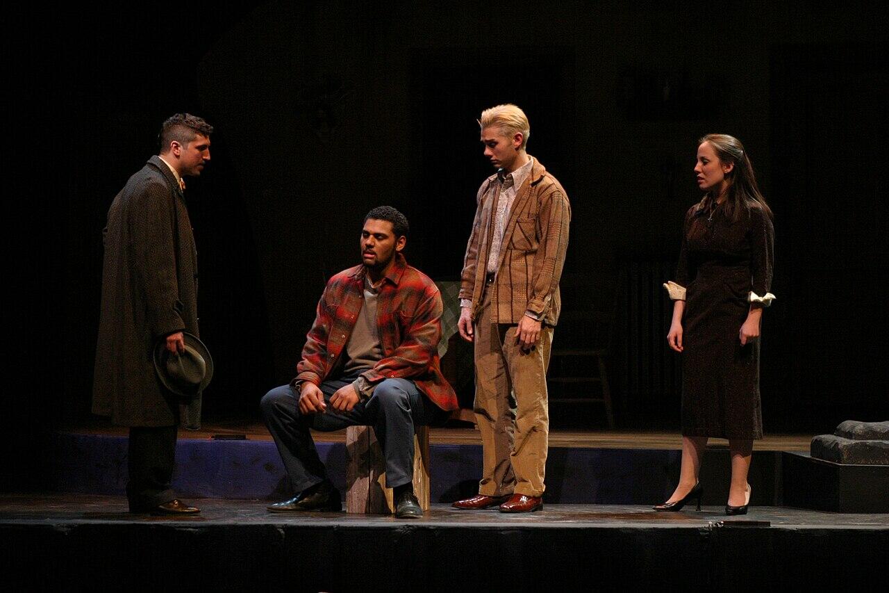 Cast members on stage