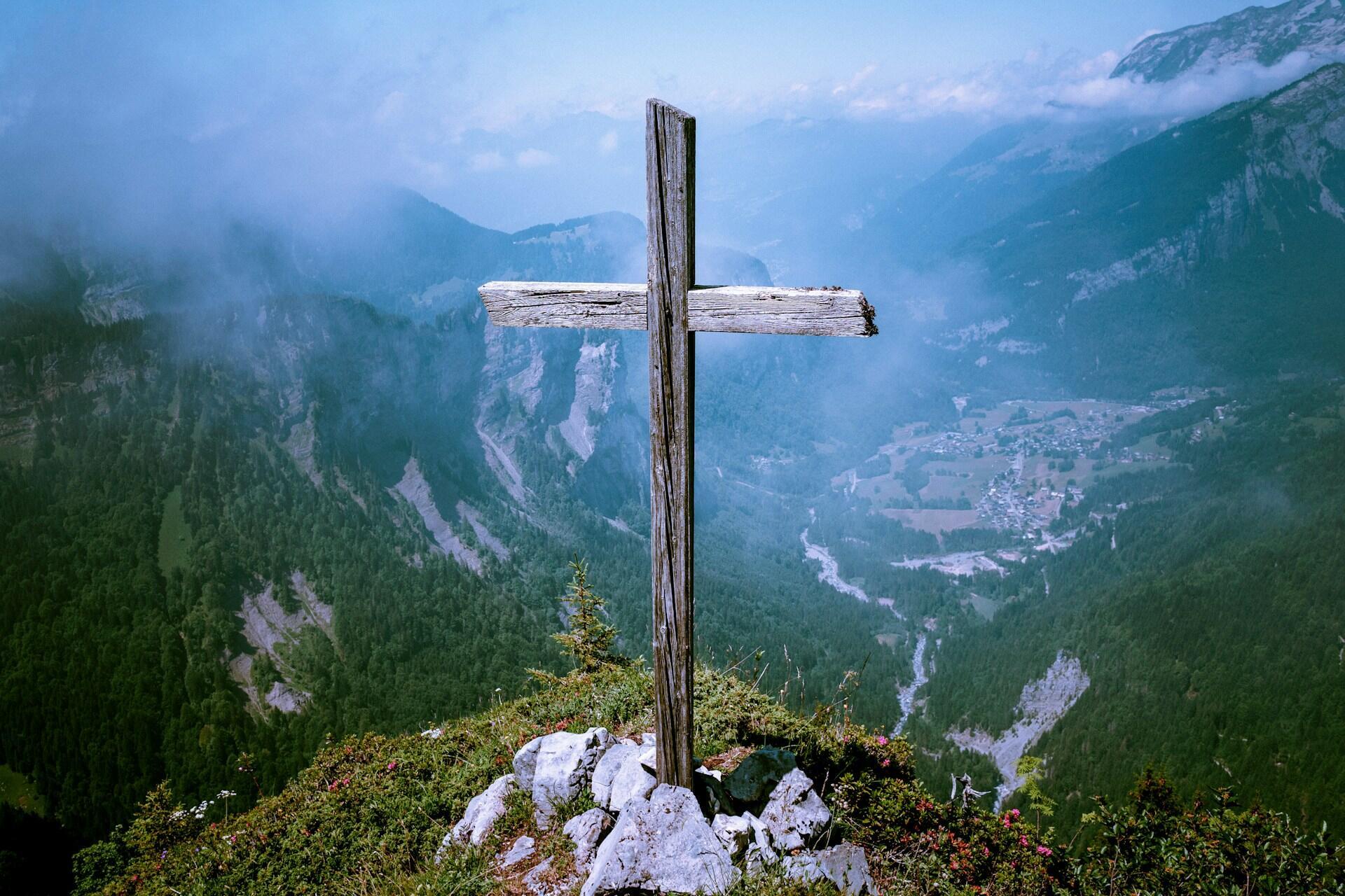 Wooden cross on a mountain