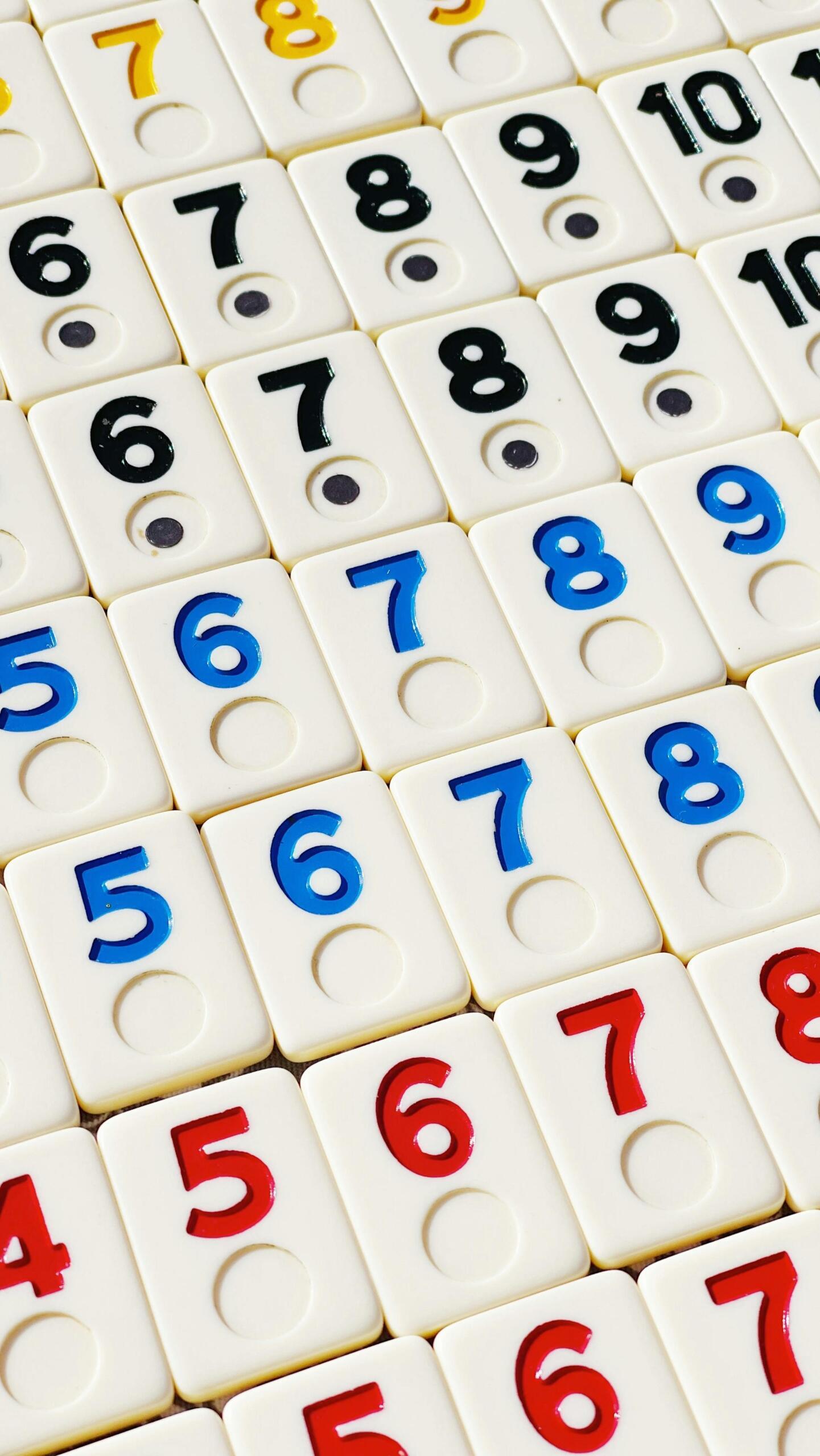 Close-up shot of small square tiles with numbers printed on them.