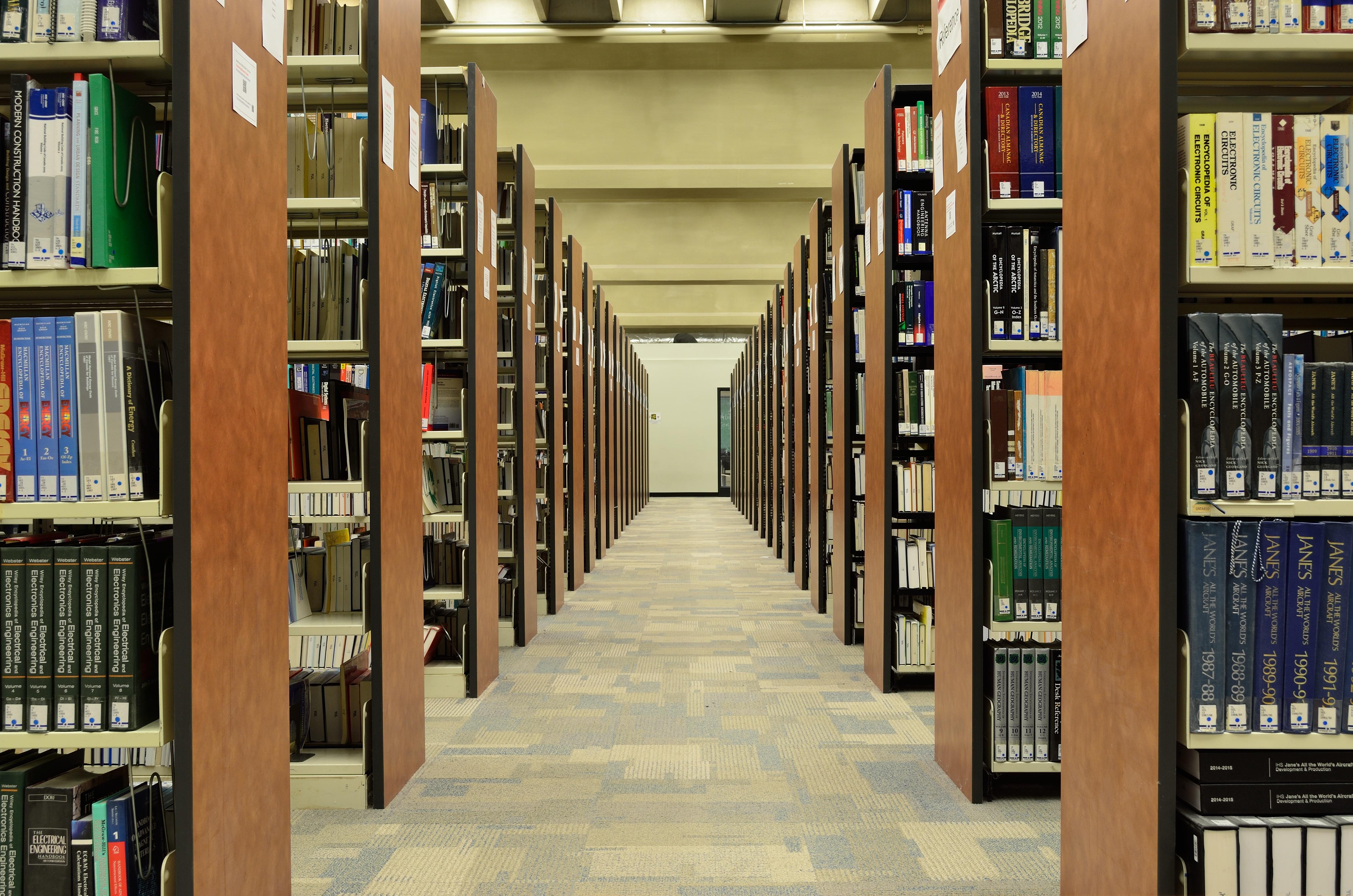Rows of bookshelves in a library.
