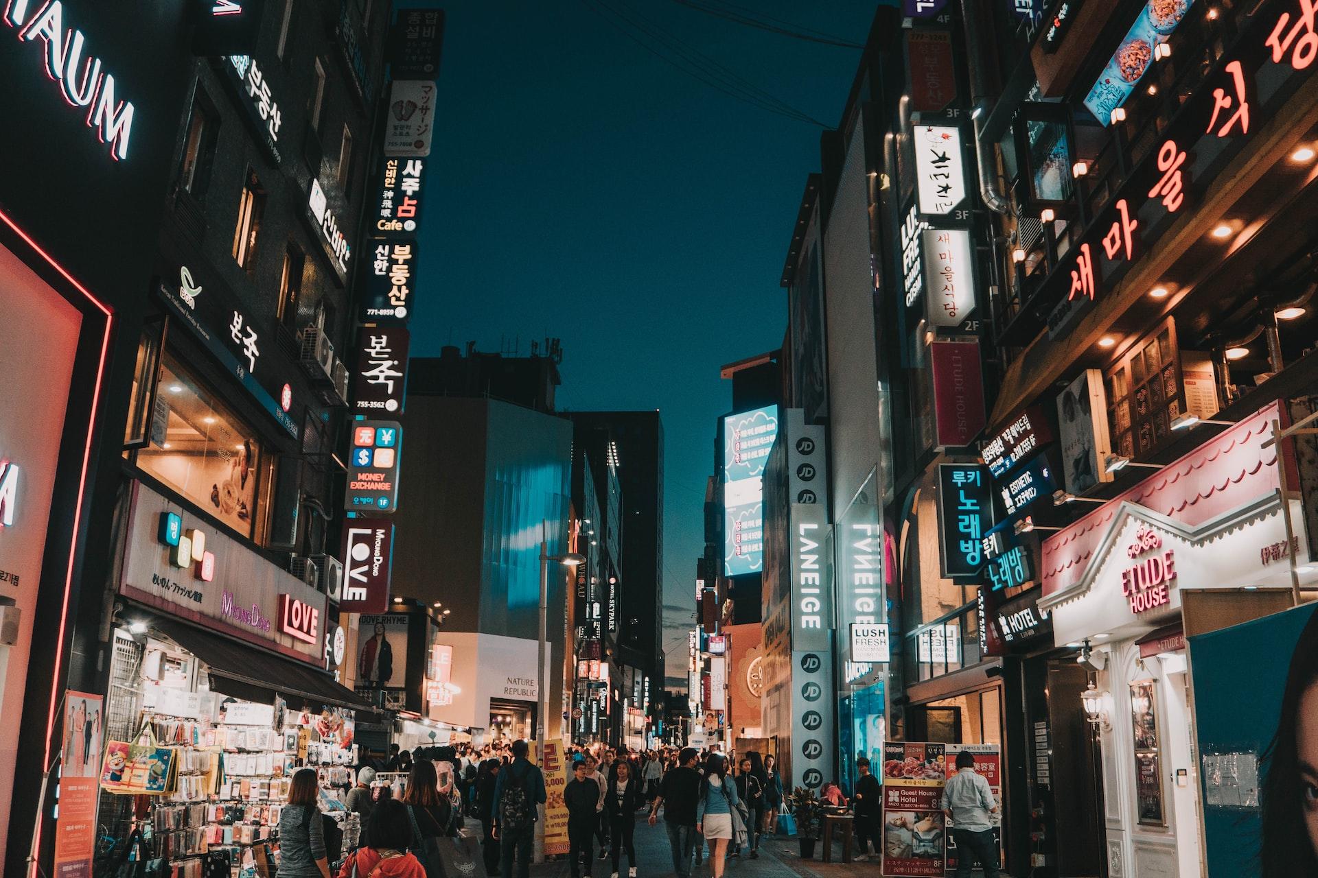 A pedestrian shopping street at night in Seoul, South Korea
