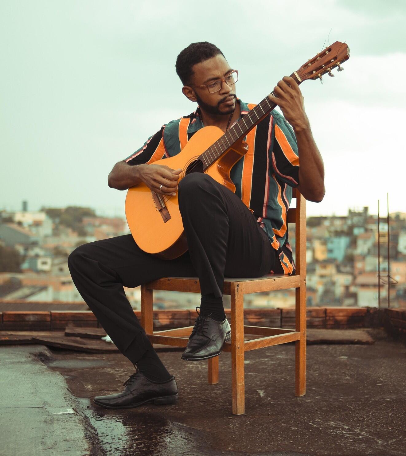 A man playing a guitar