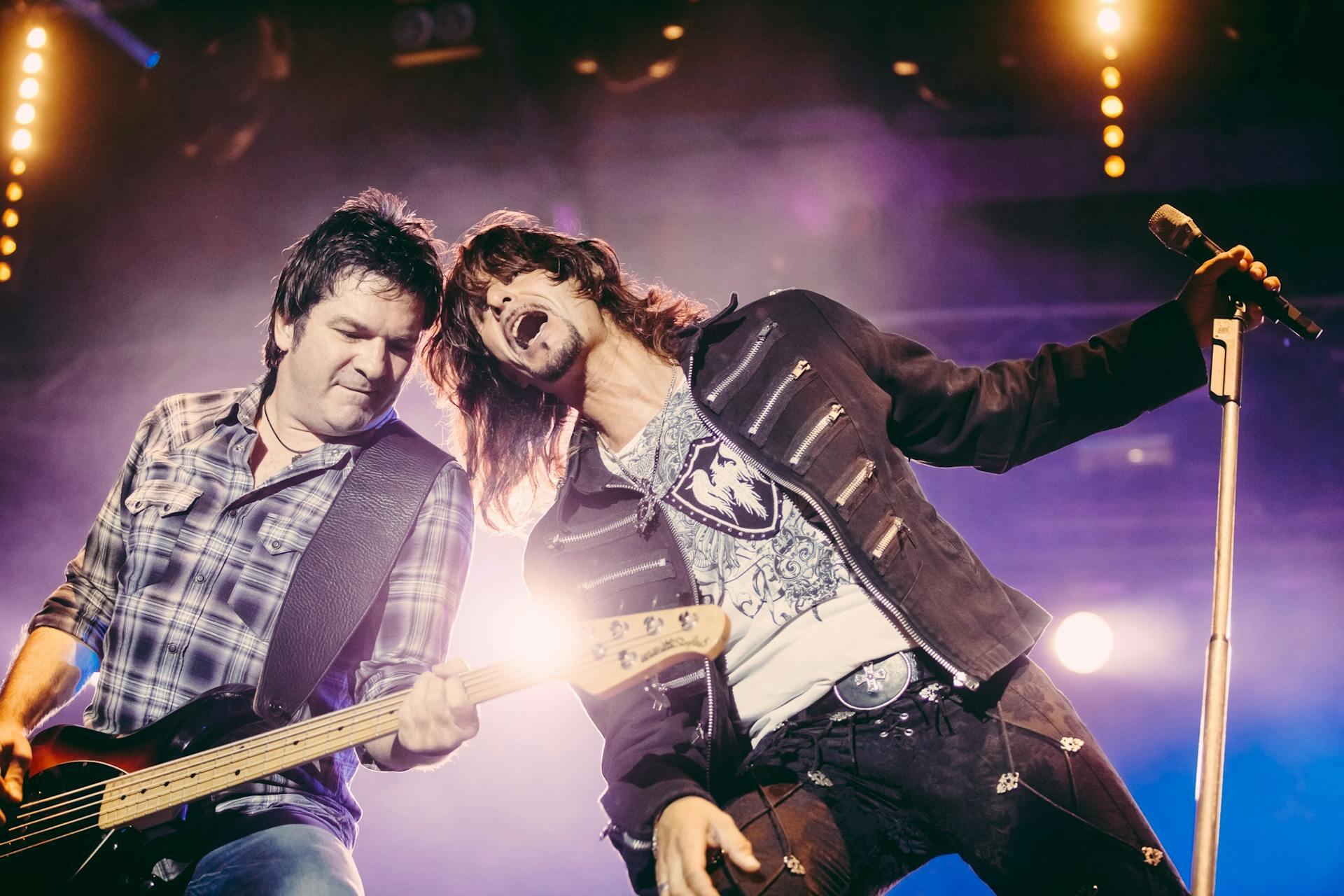 Man Playing Guitar on stage.