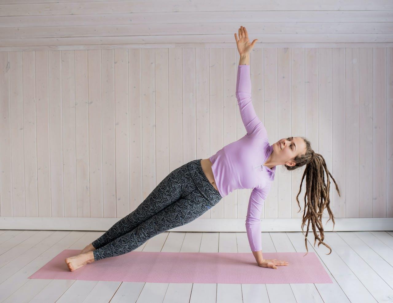 A woman doing a side plank