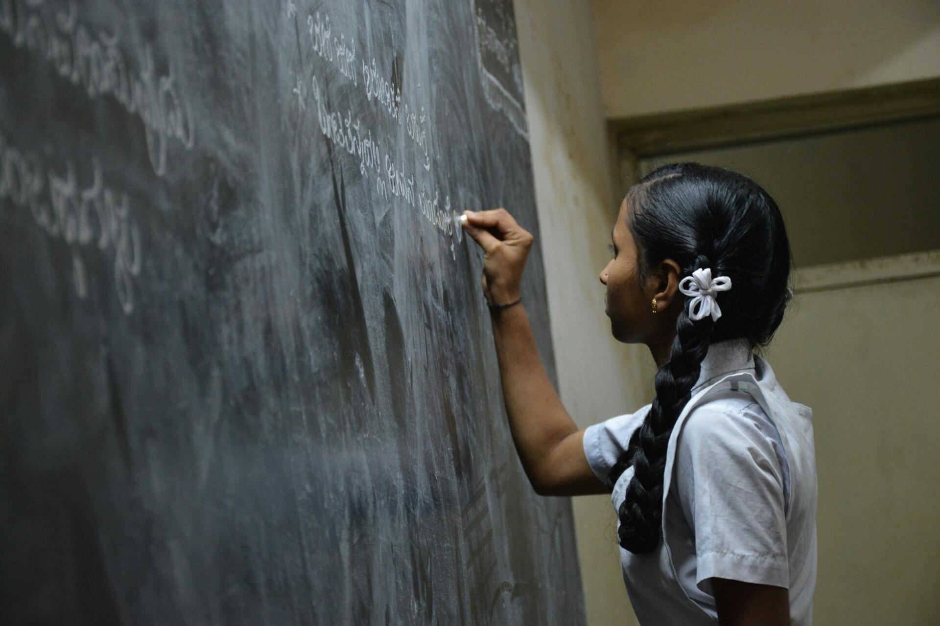 Hindi classroom lesson with students studying reading and writing skills