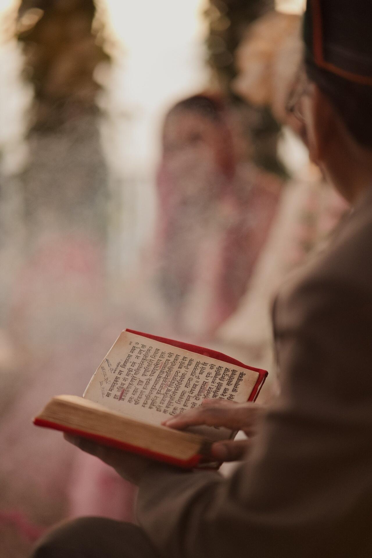 Person reading a Hindi book to improve vocabulary and reading comprehension