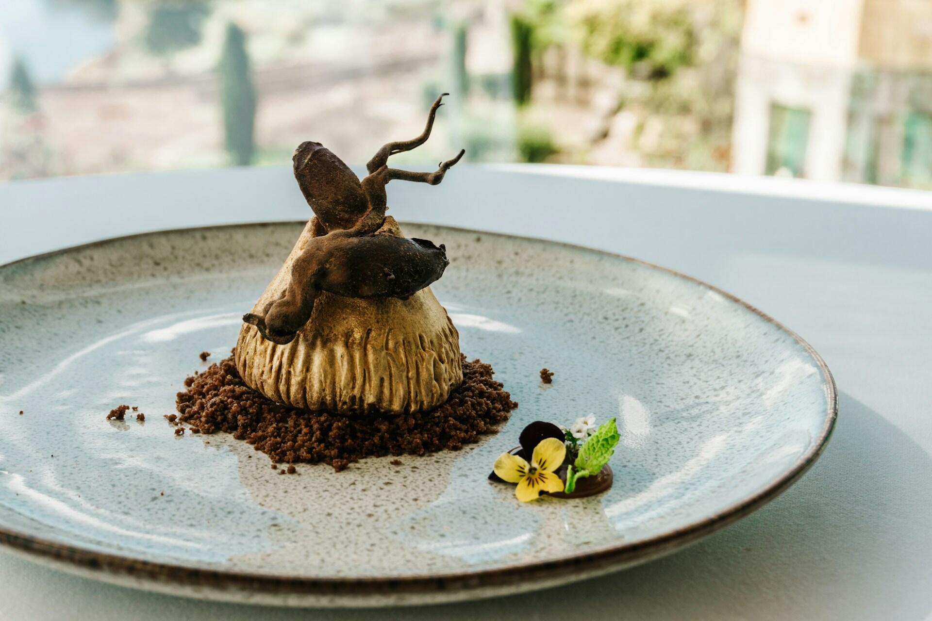 A fancy dessert on a white plate. 