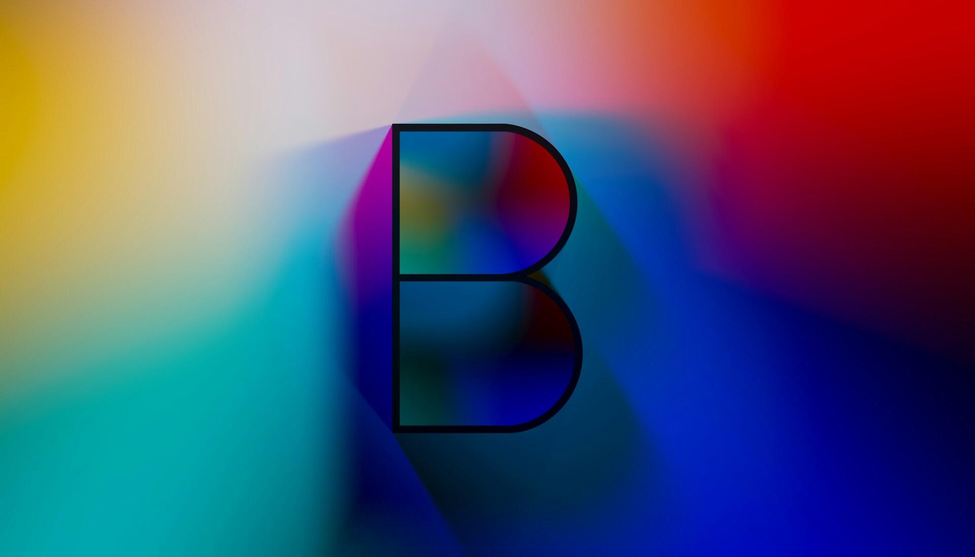 A capital B against a colourful background. 