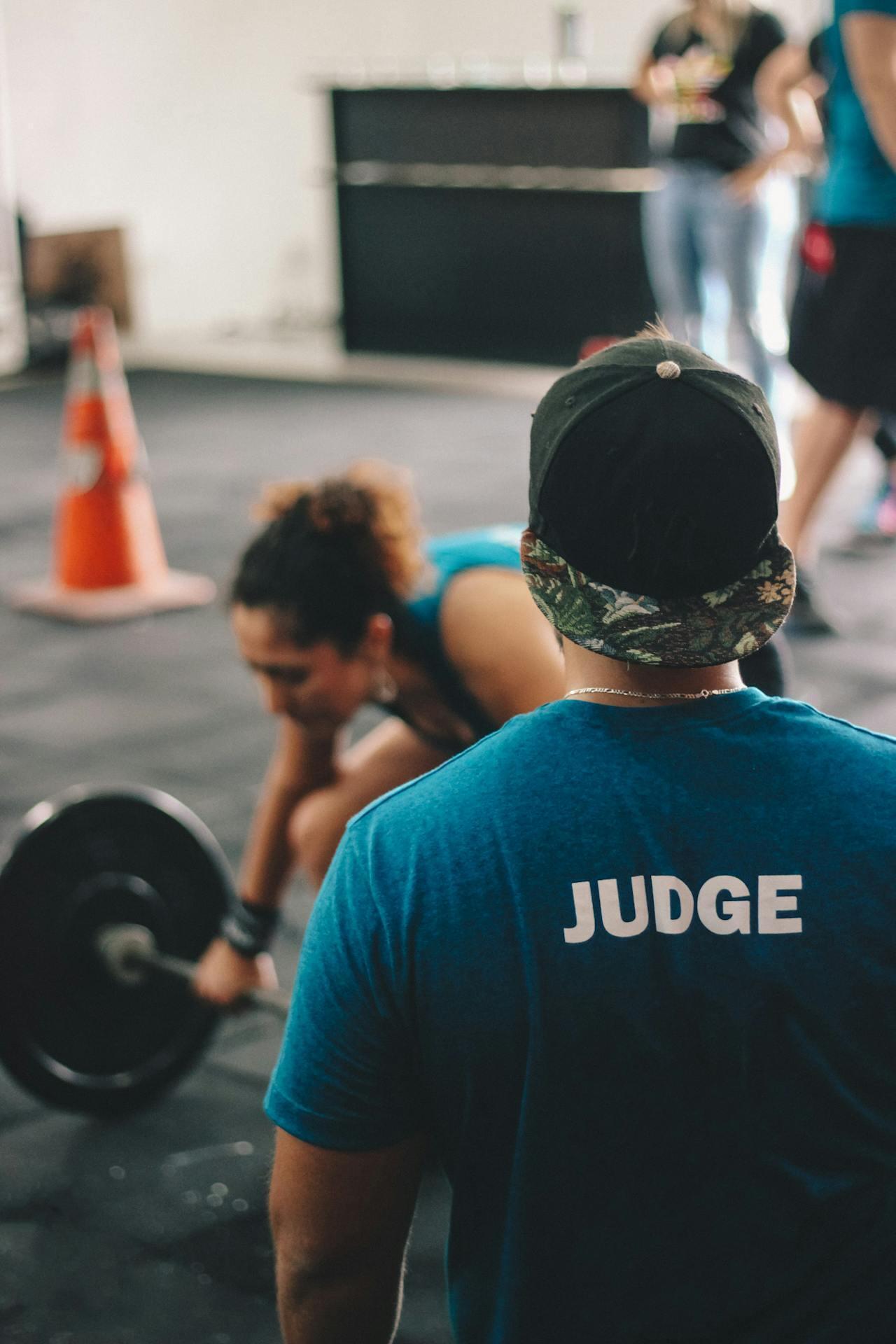 man and woman training at the gym