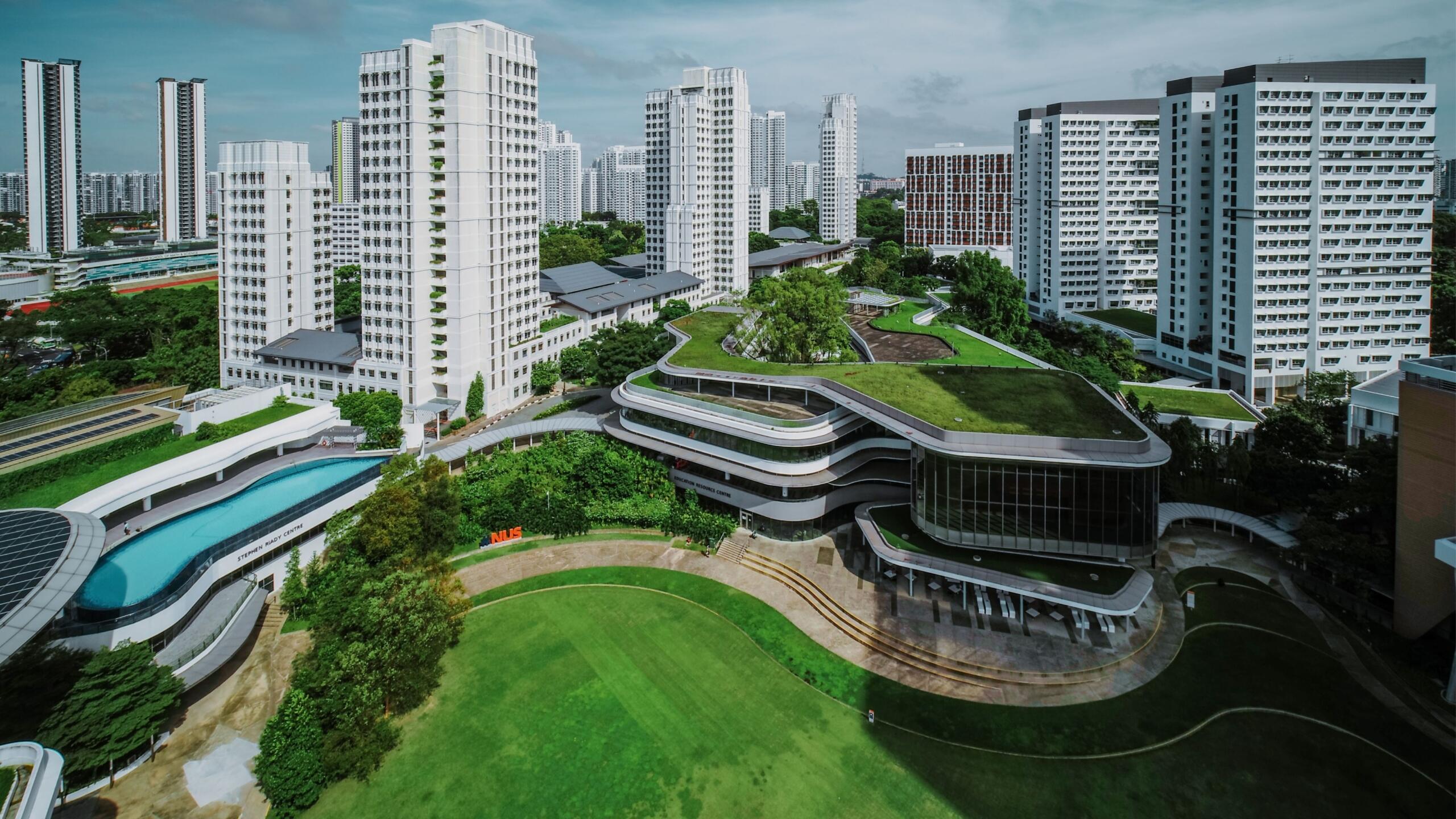 A landscape view of modern buildings at the National University of Singapore campus.