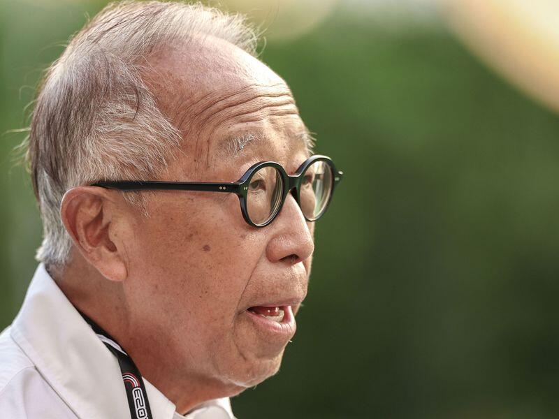 A close-up shot of businessman Ong Beng Seng, wearing black-rimmed glasses and a white-collared shirt.