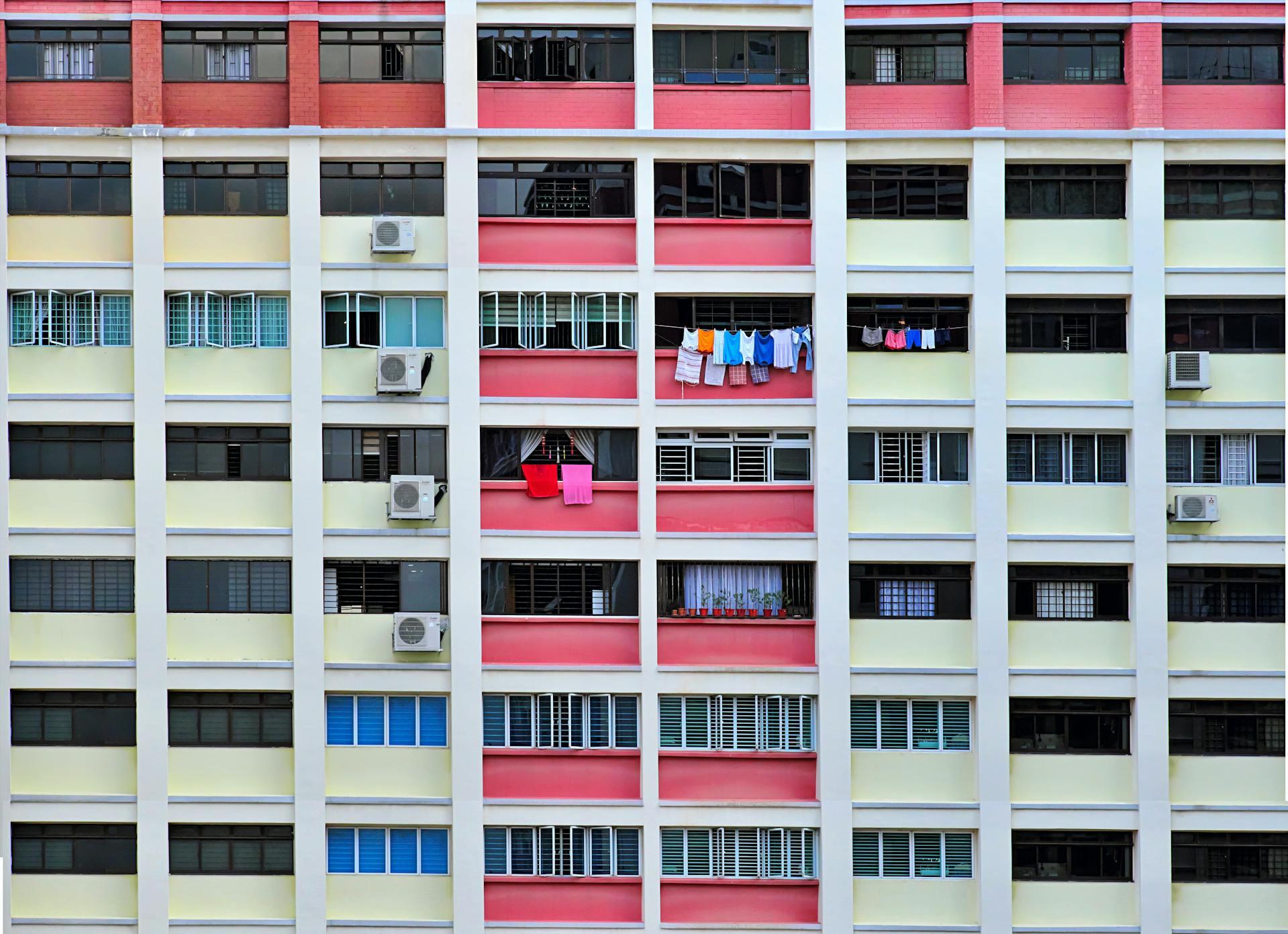 A multi-story building featuring numerous windows across its facade.  