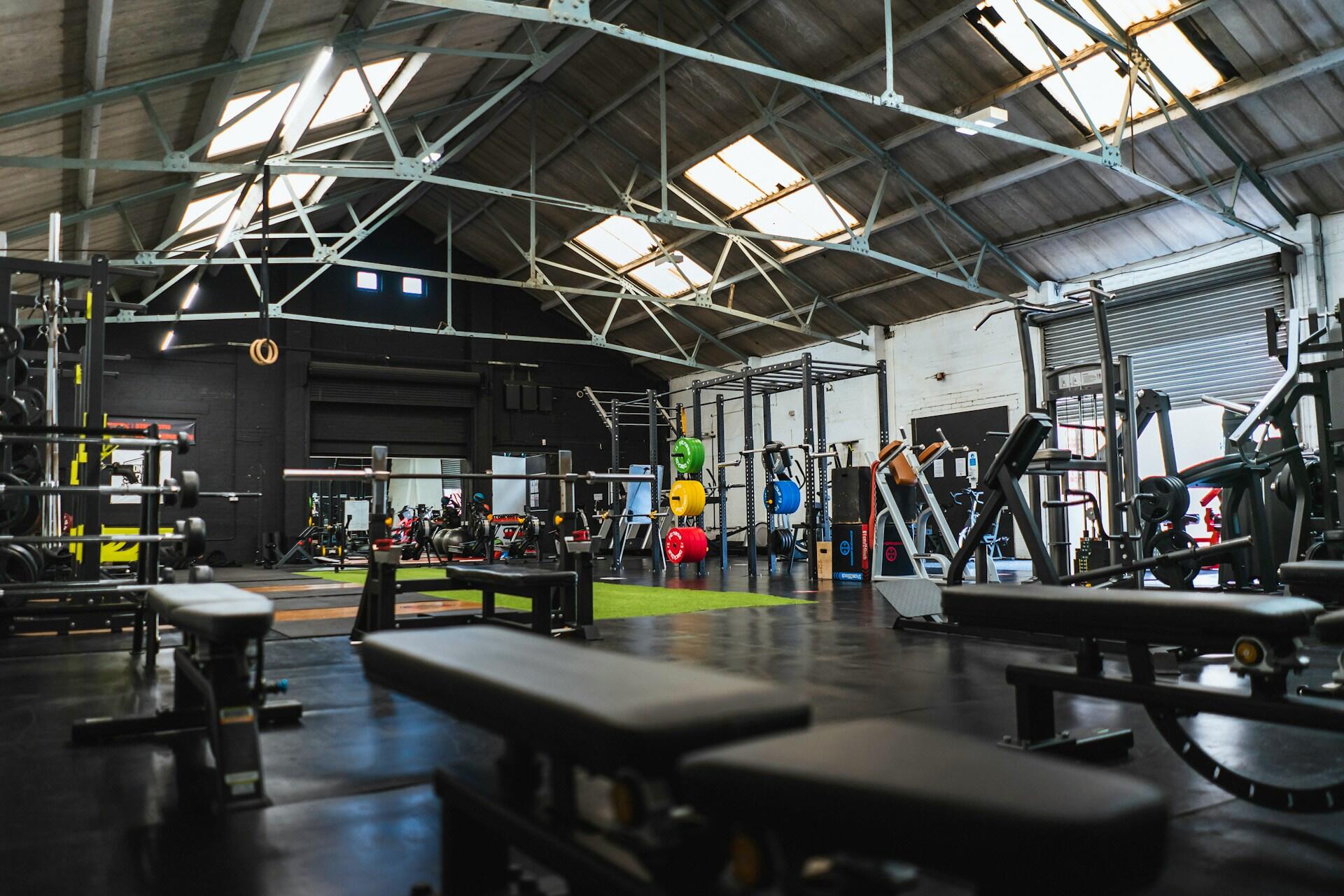 Empty gym with exercise equipment and skylights