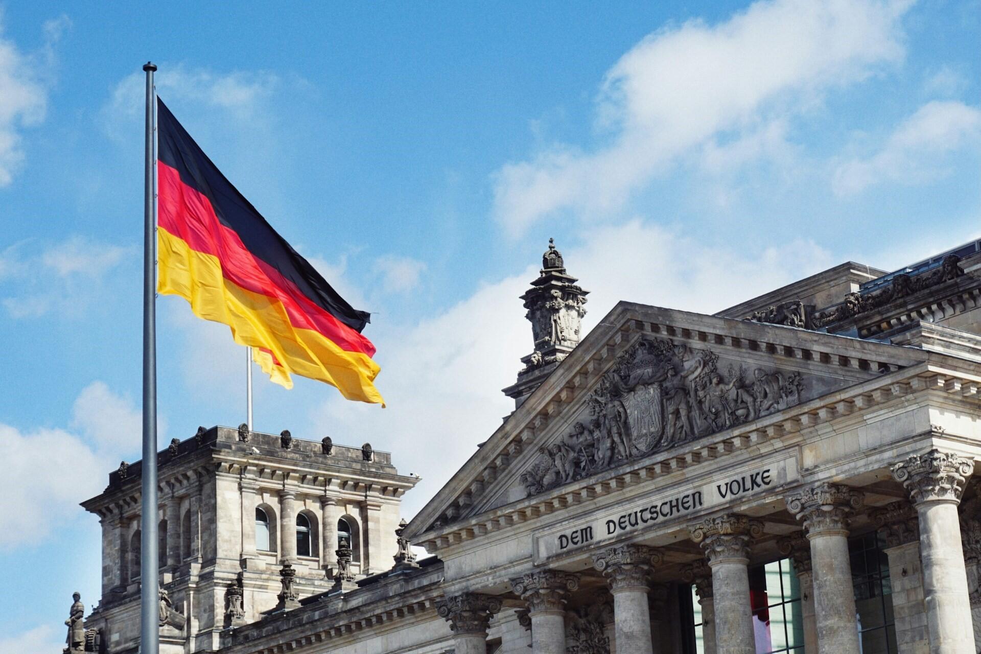 German flag outside a historic stone building