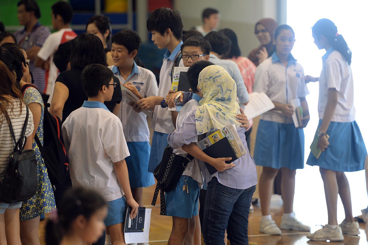 Parents sharing a warm embrace with their children after receiving an important milestone outcome.
