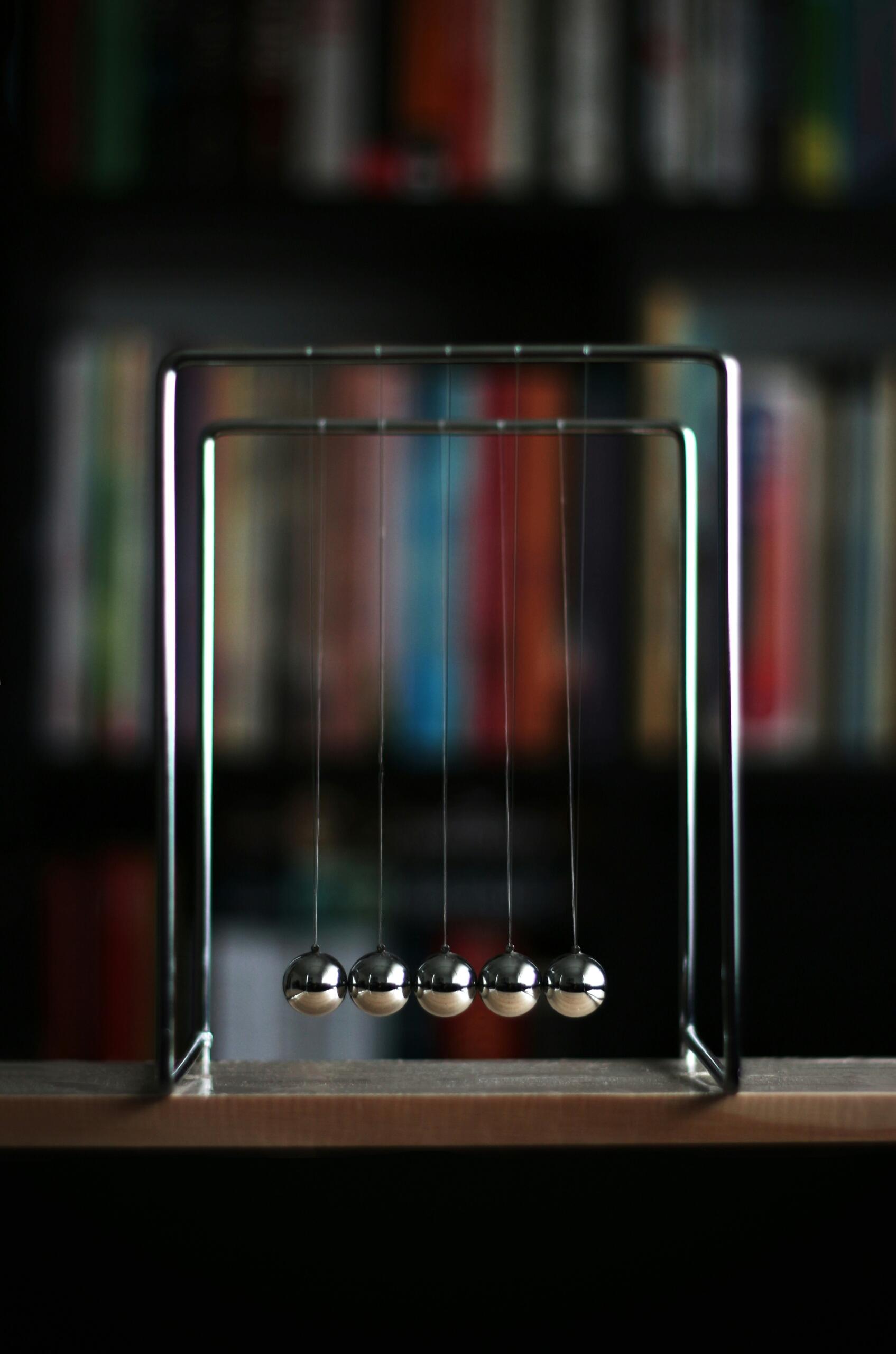 A metal Newton scale with metal balls.