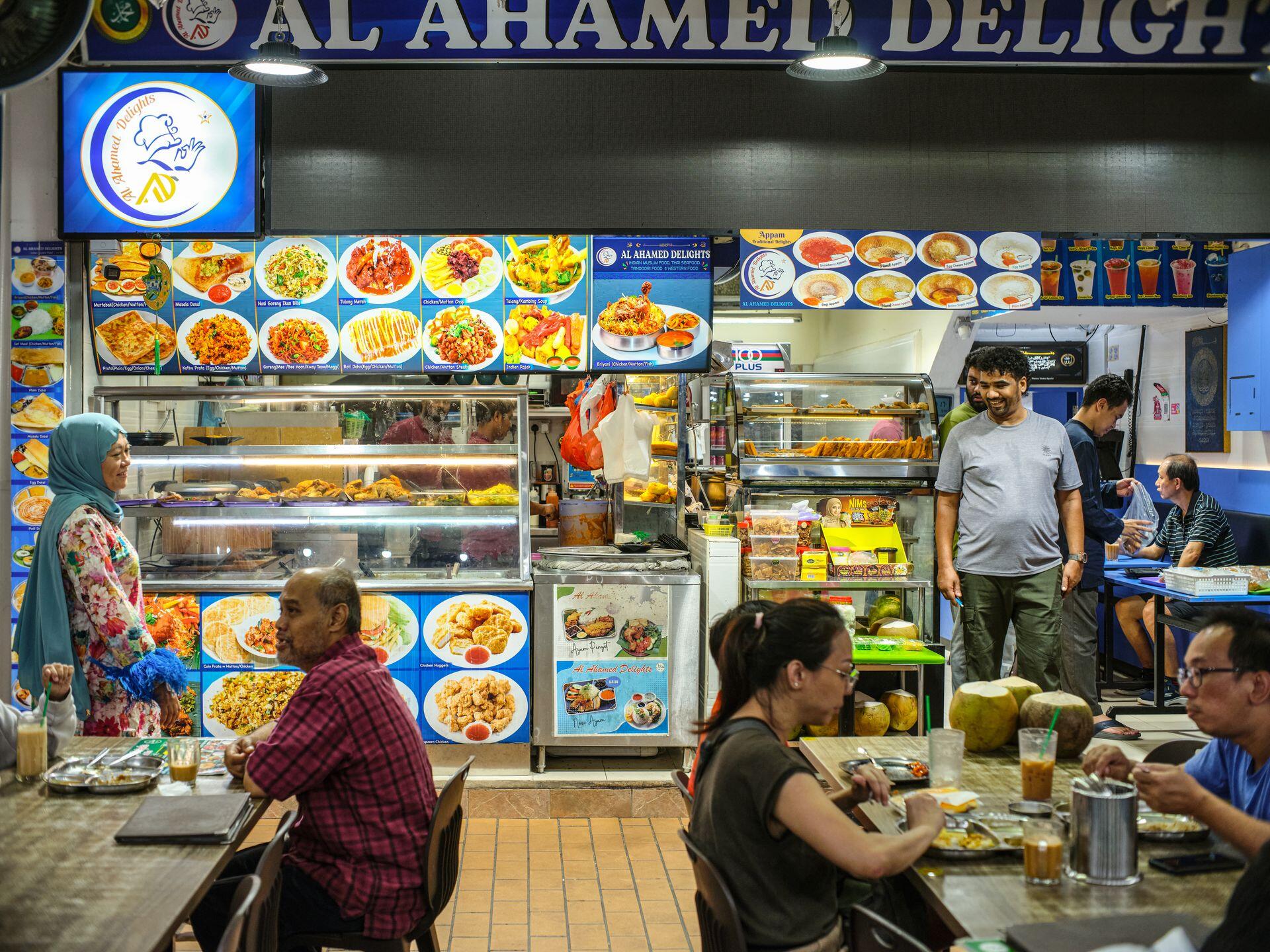 Vibrant Singapore hawker center with diverse food offerings, showcasing a lively dining atmosphere.