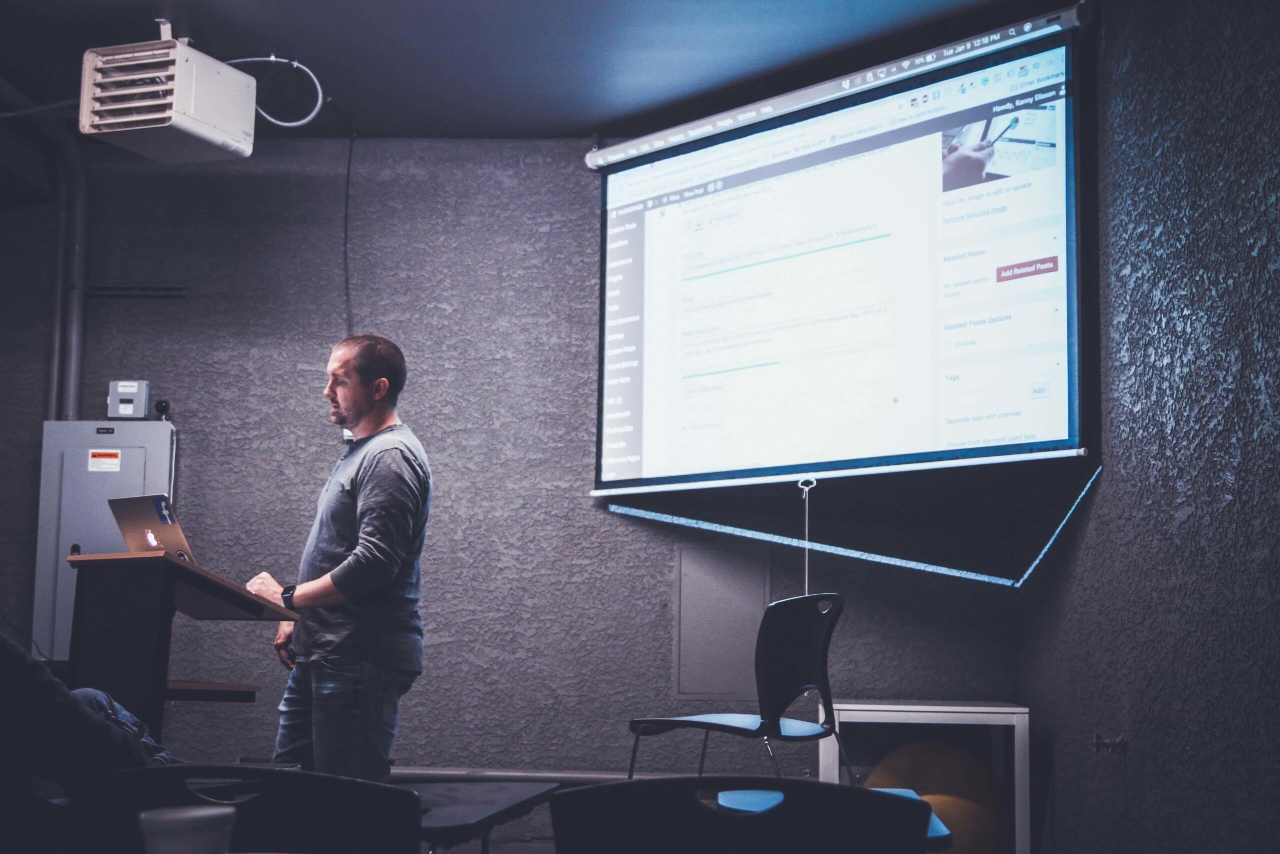 Man teaching with a projector