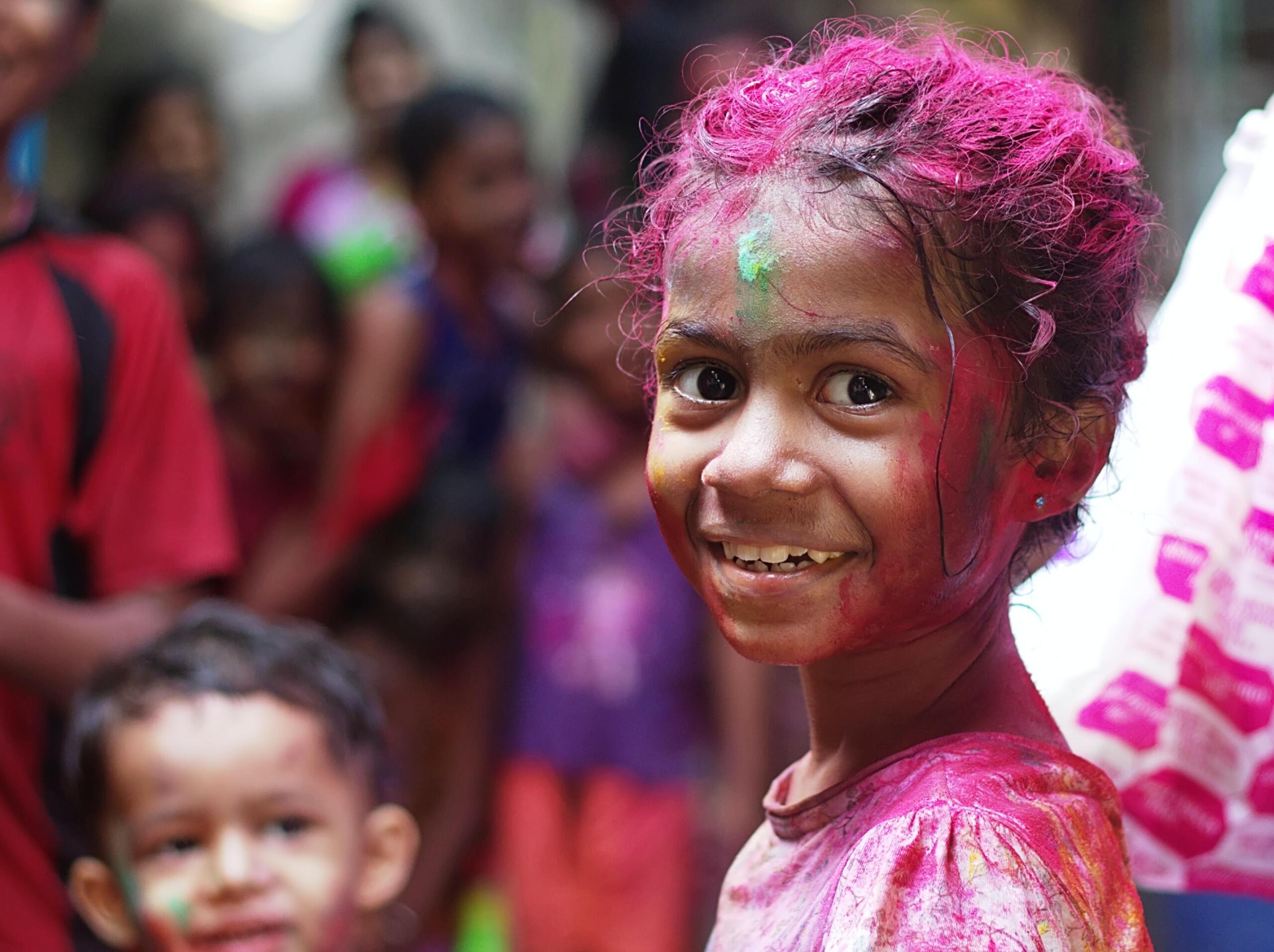 Young girl in pink paint