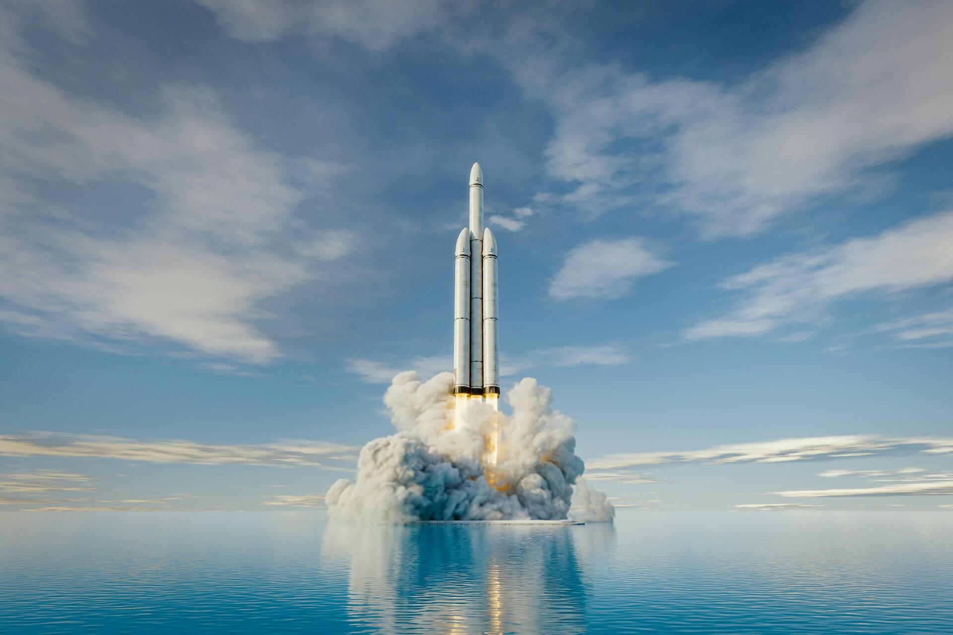 Futuristická raketa štartujúca nad vodnou hladinou do vesmíru.