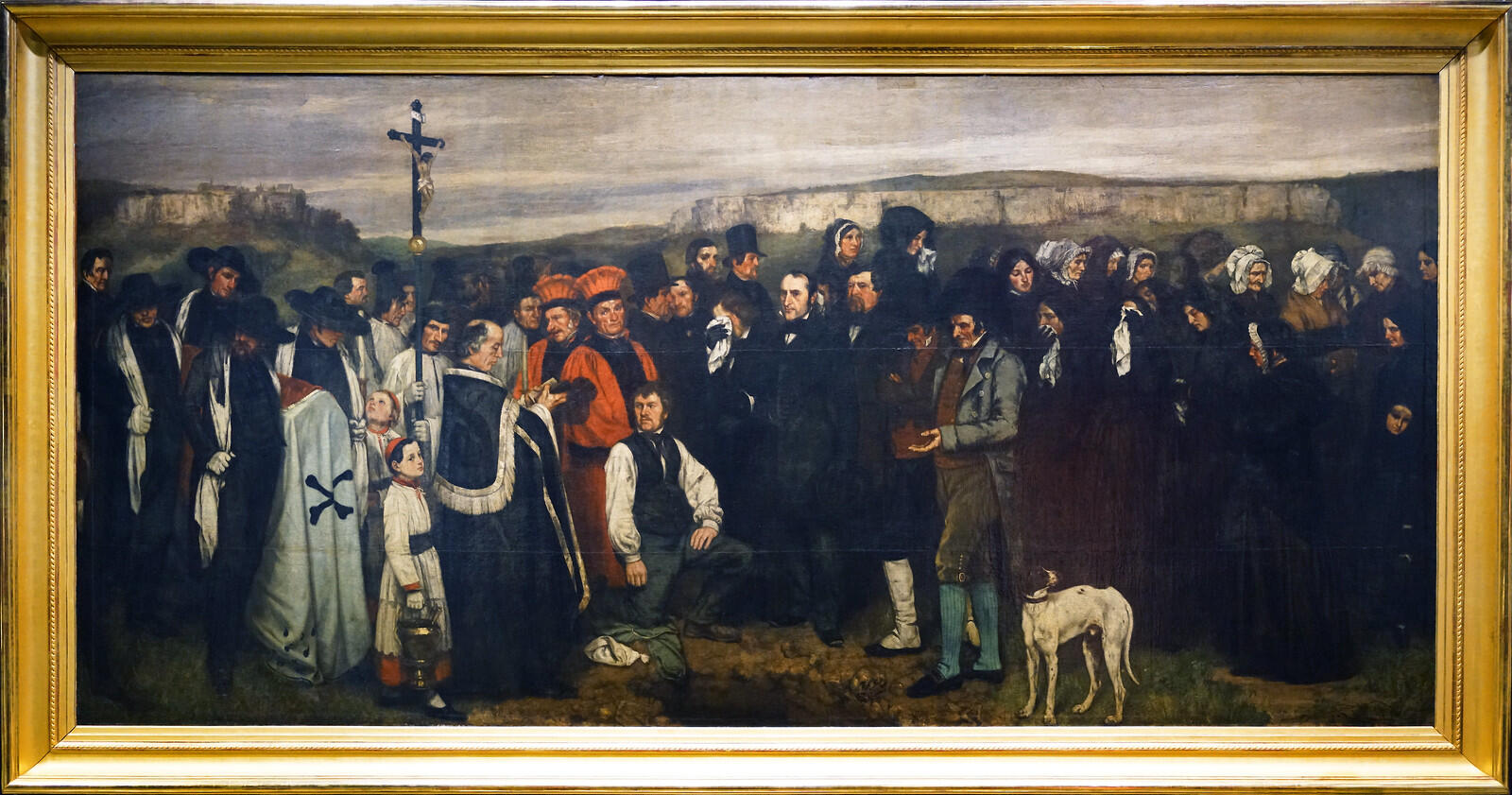 cenaze ortamı siyah giyimli insanlar papaz dua okuyor para topluyor çocuk ve köpek var